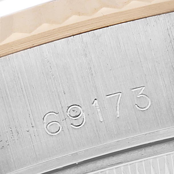 The image shows a close-up of the Rolex Datejust 69173 Women's Steel and Gold (two tone) White Dial 69173 Women's Steel and Gold (two tone) White Dial model's engraved case part with the reference number 69173.