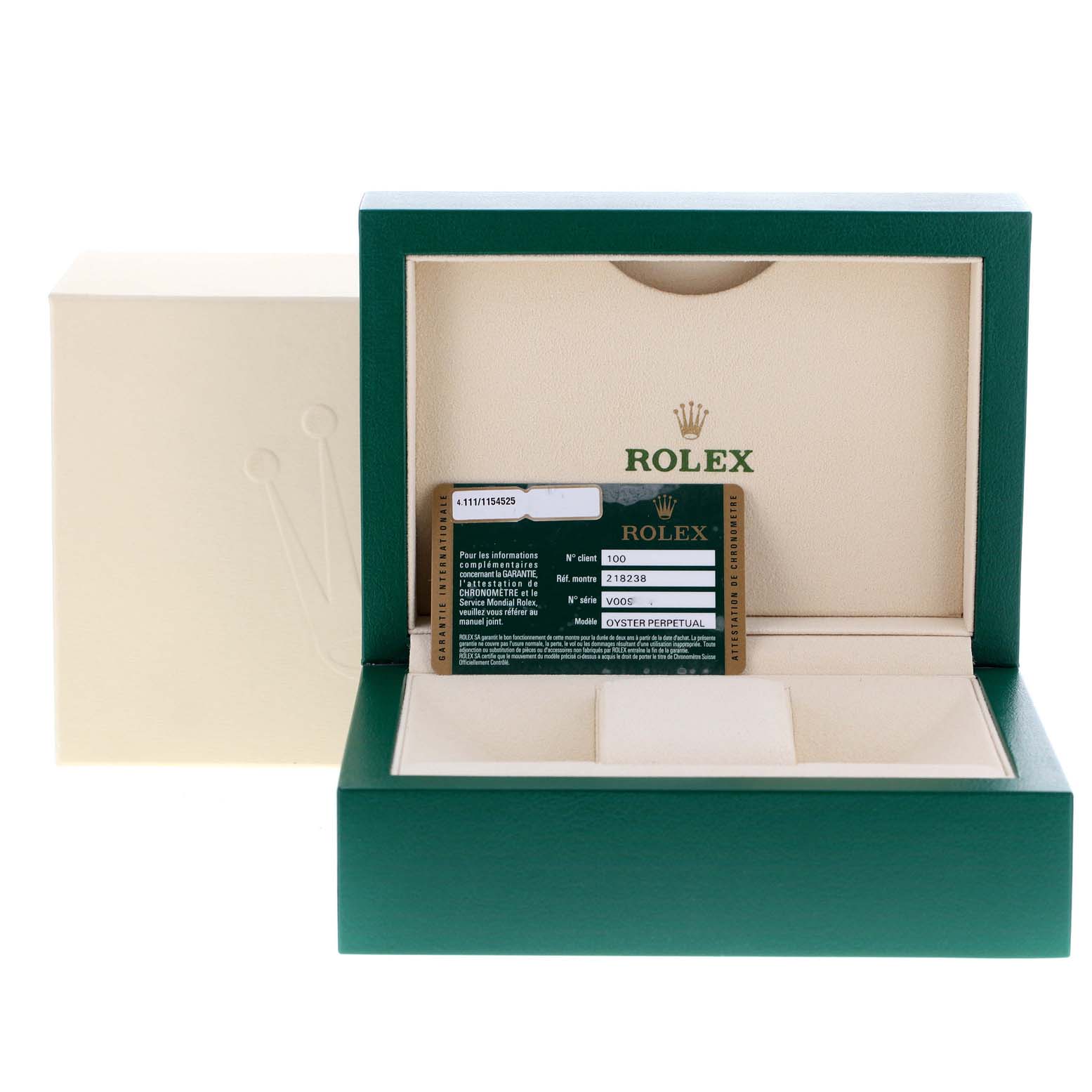 The image shows a green and cream Rolex watch box for the President model, along with the warranty card inside.