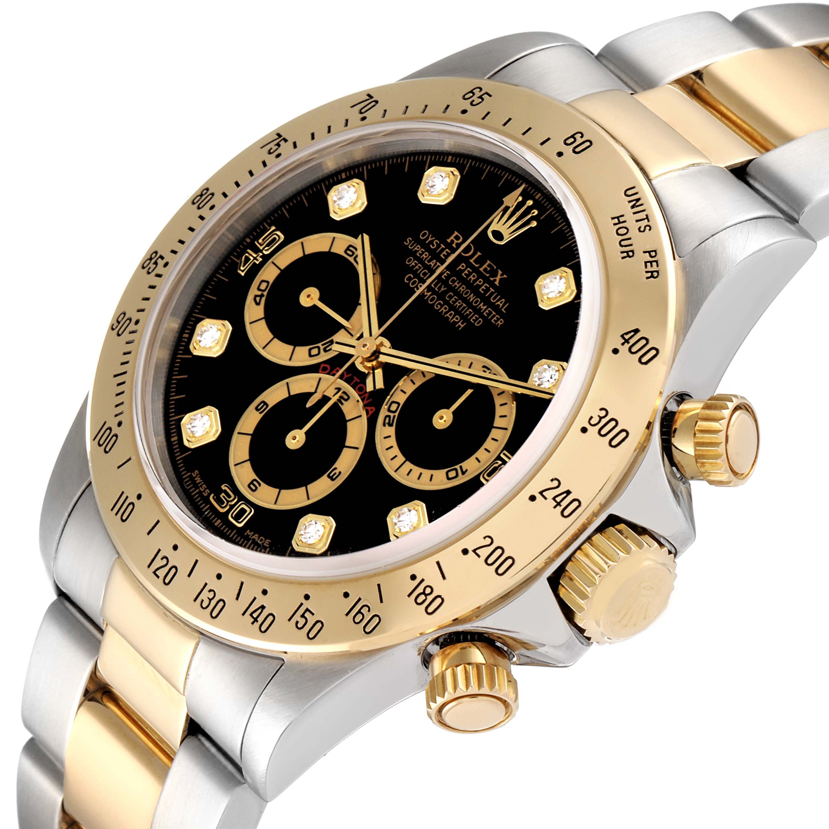 The image shows a close-up of the dial, crown, and bezel of a Rolex Daytona 16523 Men's Steel and Gold (two tone) Black Dial 16523 Men's Steel and Gold (two tone) Black Dial watch, emphasizing its gold and silver detailing.