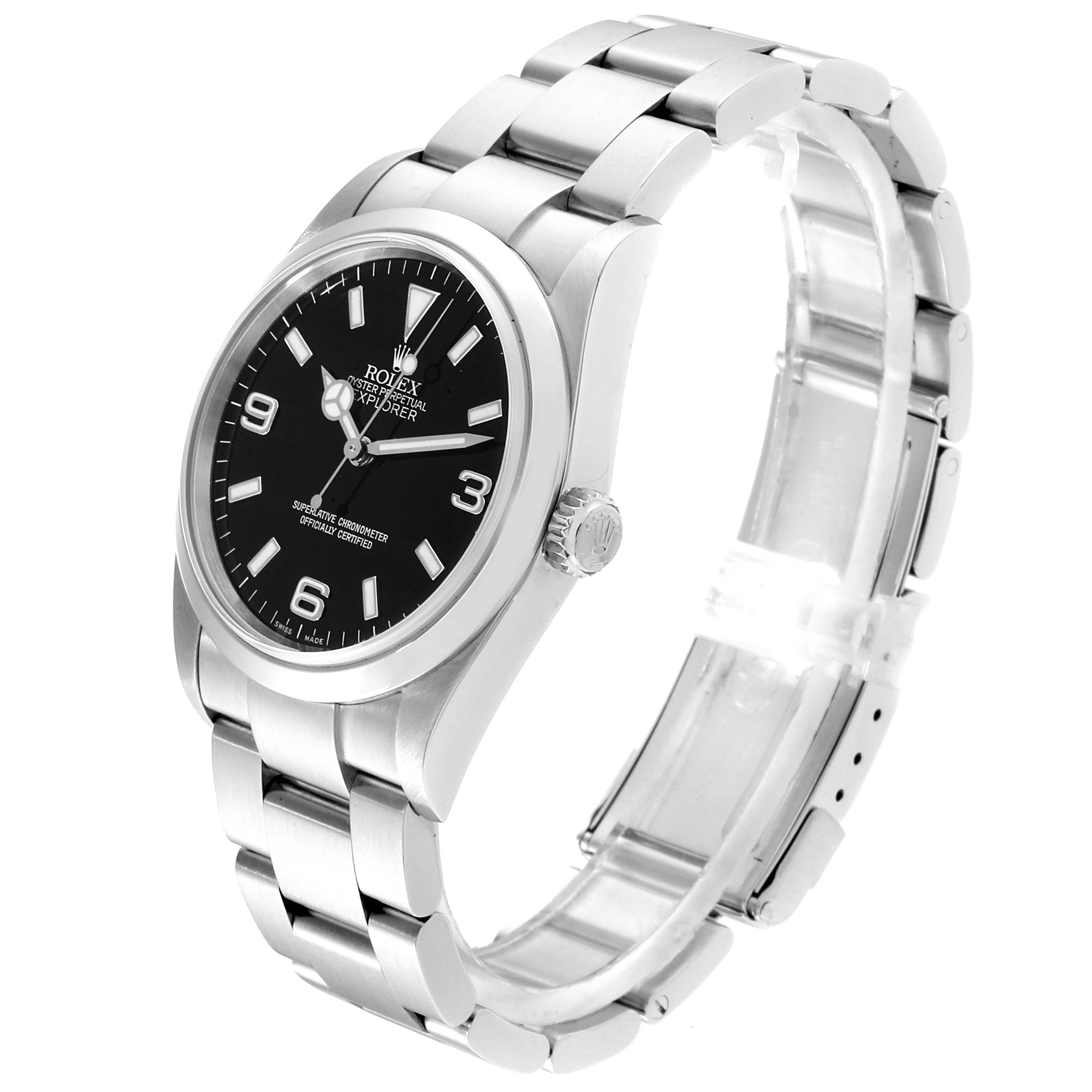 The image shows an angled side view of a Rolex Explorer 114270 Men
s Stainless Steel Black Dial 114270 Men
s Stainless Steel Black Dial watch, highlighting the black dial, stainless steel case, bracelet, and crown.