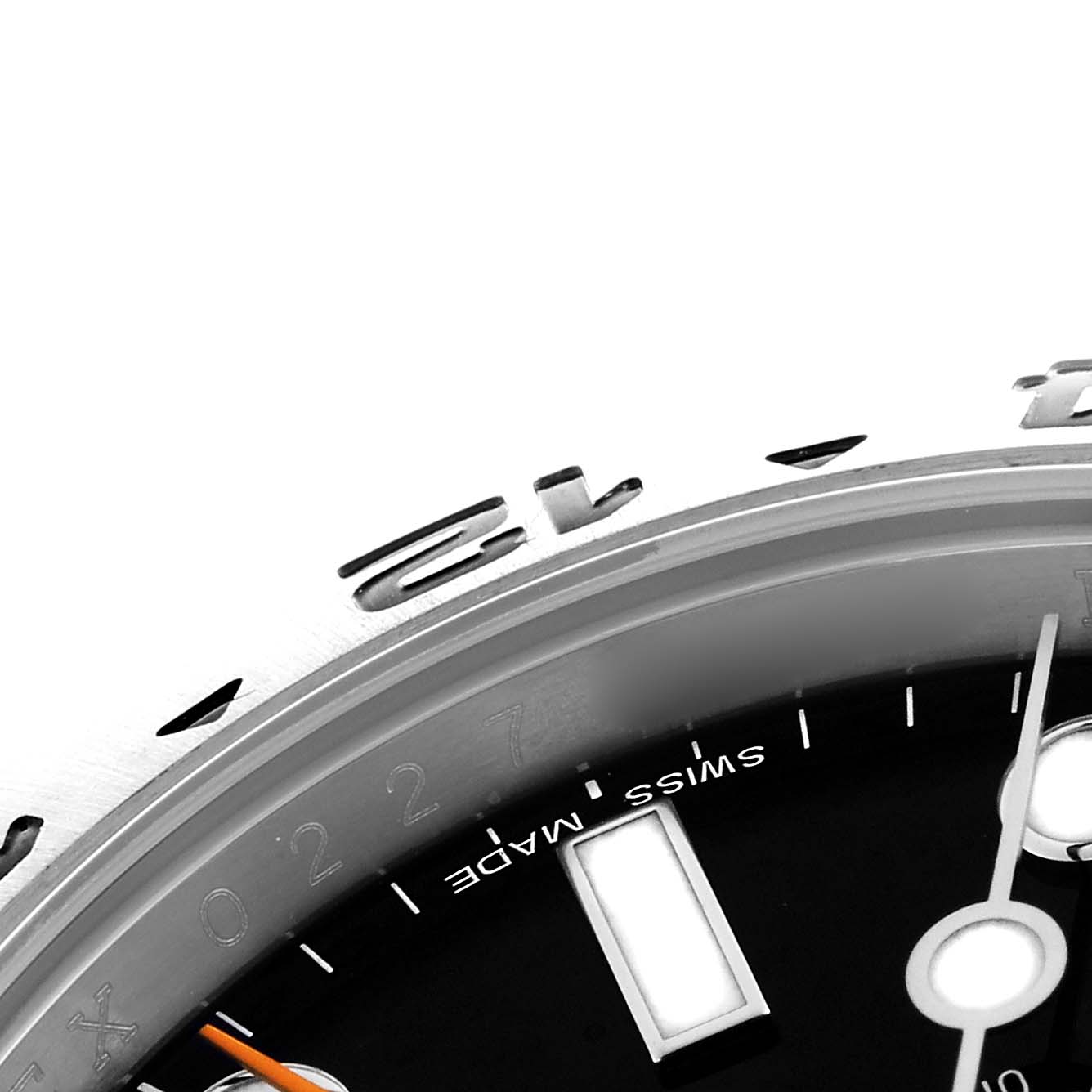 The image shows a close-up of the Rolex Explorer 216570 Men's Stainless Steel Black Dial 216570 Men's Stainless Steel Black Dial bezel, partial dial, and hands viewed from an angled perspective.