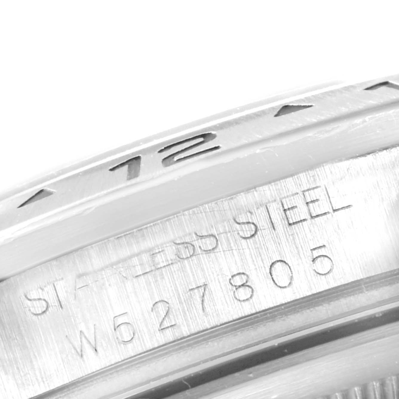 The image shows a close-up of the engraving on the stainless steel bezel and case edge of a Rolex Explorer 16570 Men
s Stainless Steel Black Dial 16570 Men
s Stainless Steel Black Dial watch.