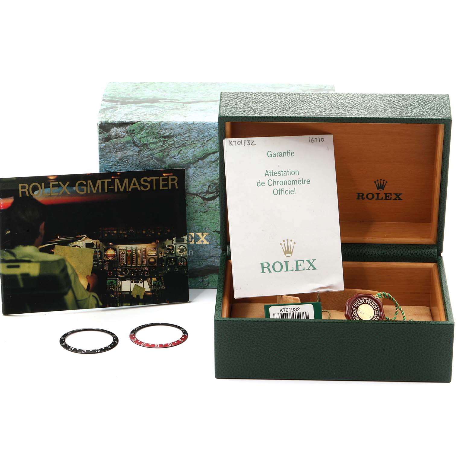 The image shows a Rolex GMT-Master 16710 Men's Stainless Steel Black Dial 16710 Men's Stainless Steel Black Dial watch box, warranty card, manual, and two bezel inserts.