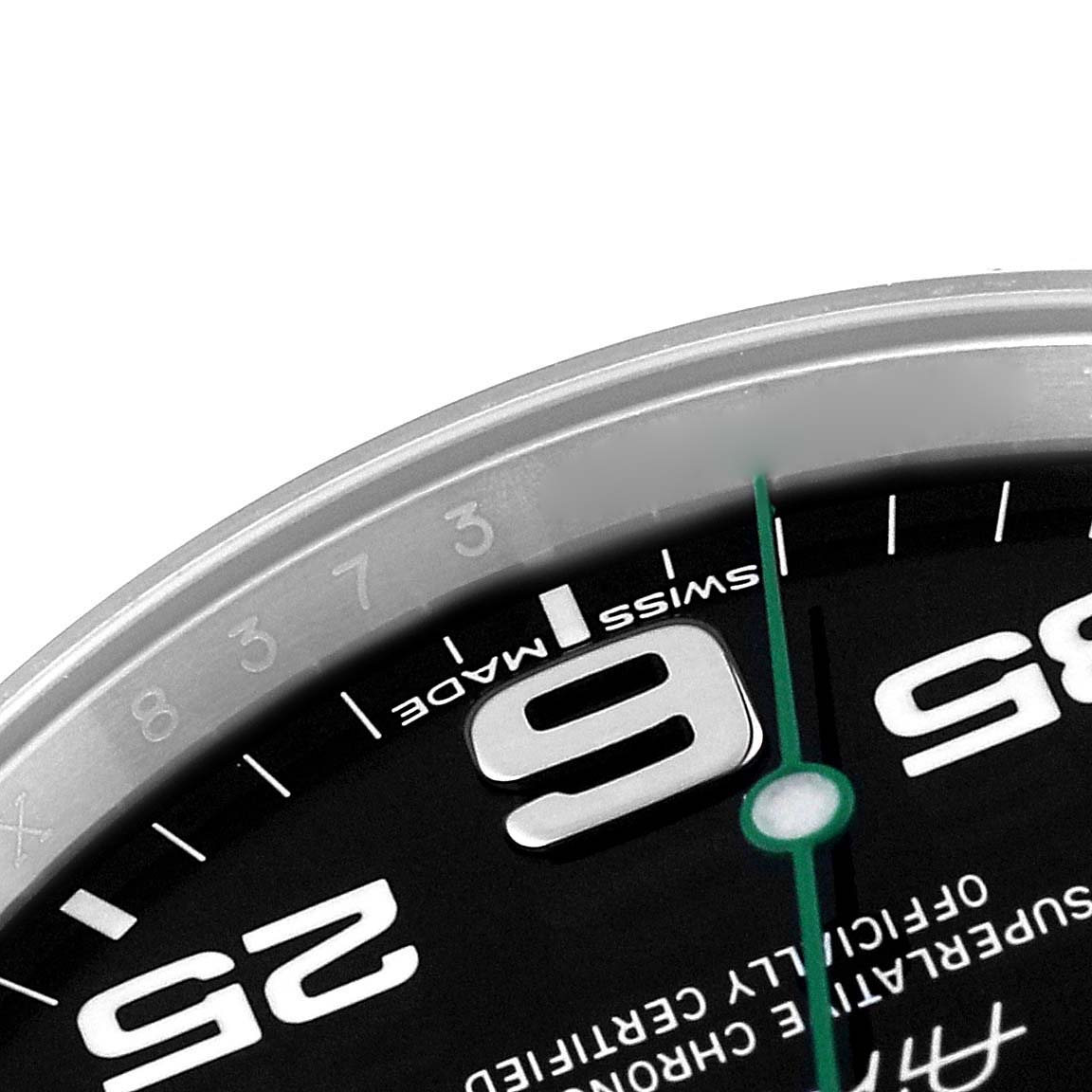This close-up image of the Rolex Air-King 116900 Men's Stainless Steel Black Dial 116900 Men's Stainless Steel Black Dial watch shows parts of the dial, including the numbers 9, 25, and 35.