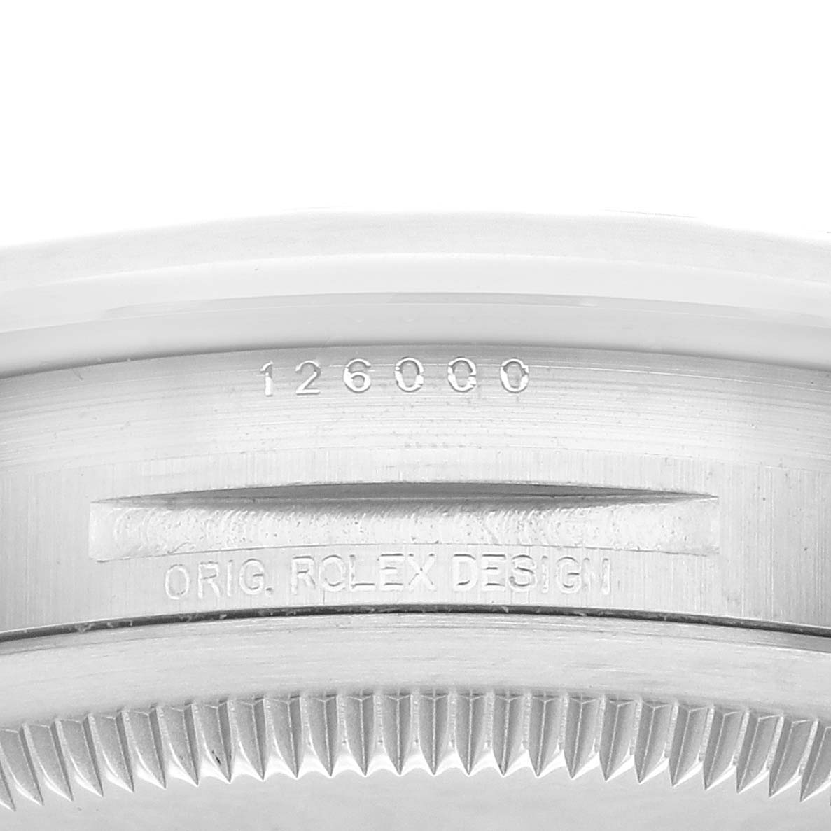 This image shows a close-up of the case back of a Rolex Oyster Perpetual 126000 Men
s Stainless Steel Black Dial 126000 Men
s Stainless Steel Black Dial watch, displaying the model number and "ORIG. ROLEX DESIGN" engraving.