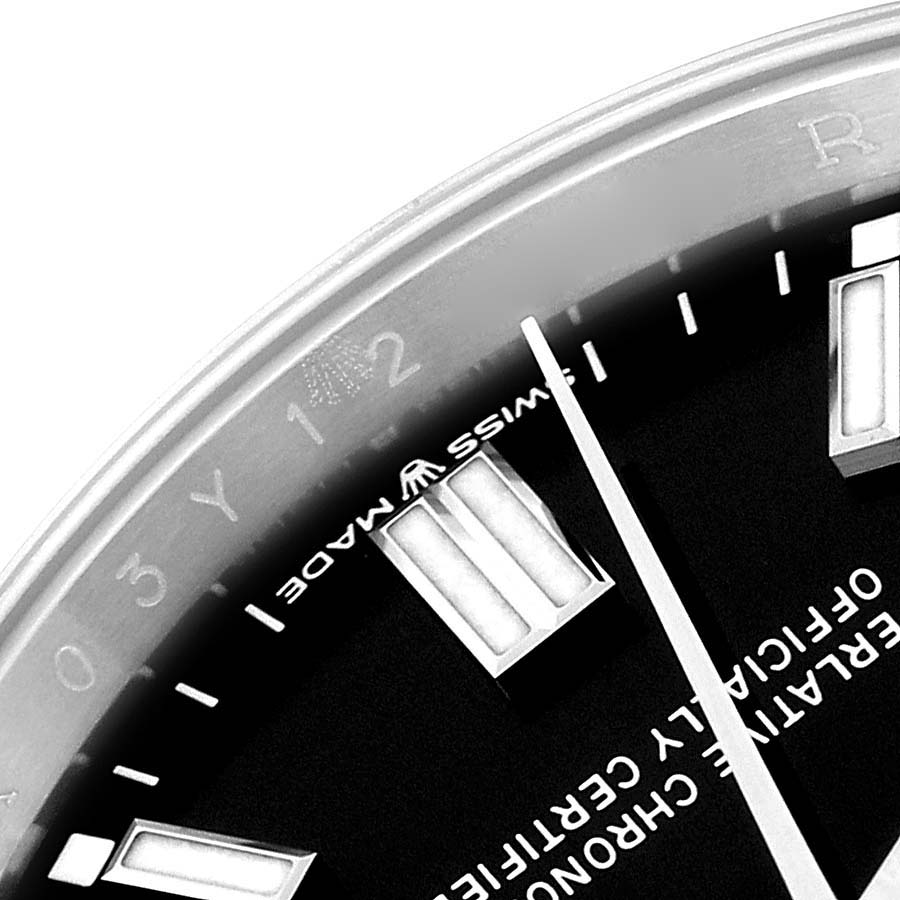 This image shows a close-up of the dial and minute markers on a Rolex Oyster Perpetual 126000 Men
s Stainless Steel Black Dial 126000 Men
s Stainless Steel Black Dial watch.