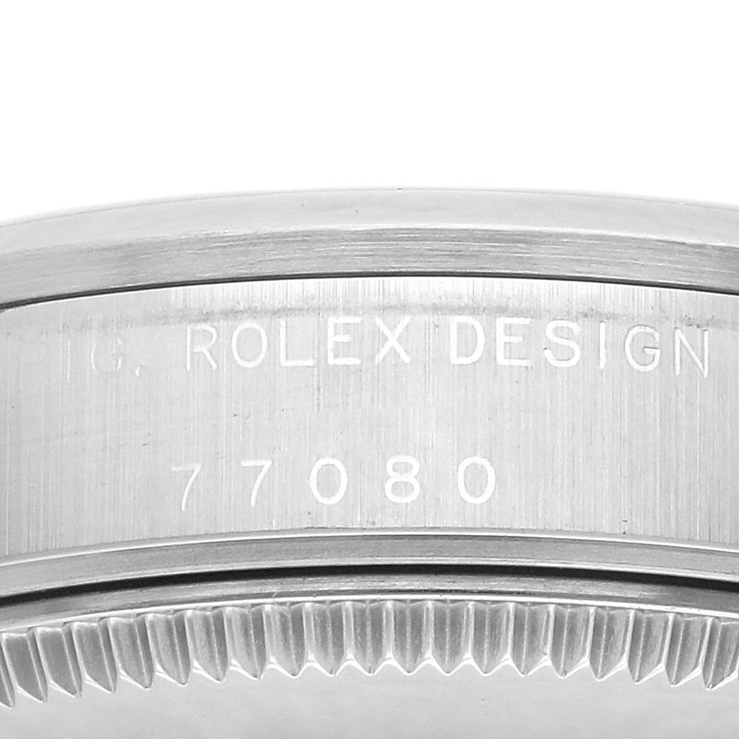 The image shows a close-up of the side of a Mid-Size Rolex watch, highlighting the engraved model number 77080.