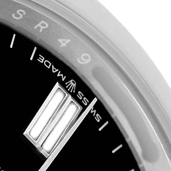 The image shows a close-up of the dial and chapter ring of a Rolex Oyster Perpetual 126000 Men's Stainless Steel Black Dial, featuring the "Swiss Made" inscription.
