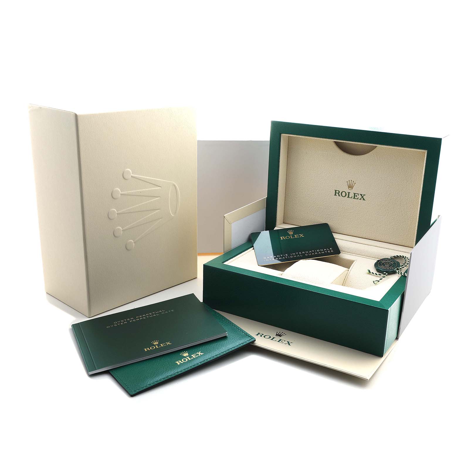 The image shows the packaging and accessories of a Rolex Oyster Perpetual 126000 Men's Stainless Steel Black Dial, including the box, warranty card, and booklet.