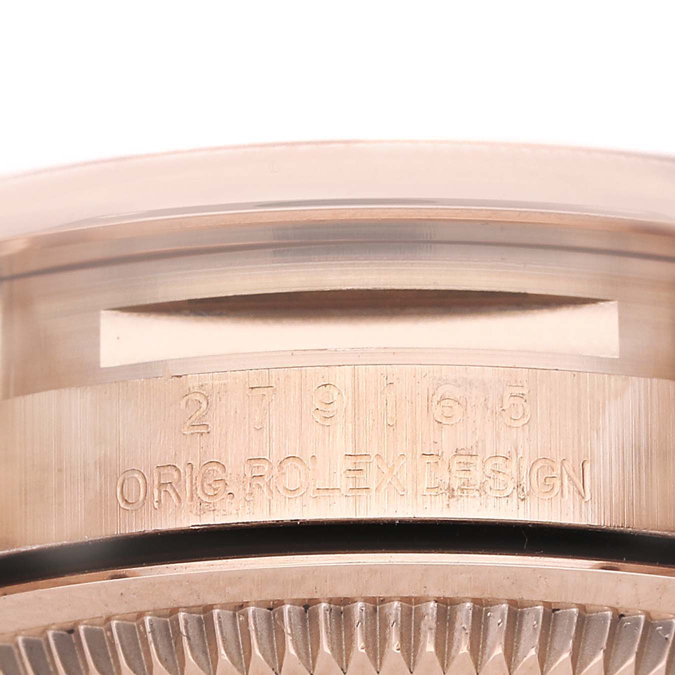 The image shows the side view of a Rolex President 279165 Women's Rose Gold Pink Dial model, highlighting the engraved serial and design numbers on the case.