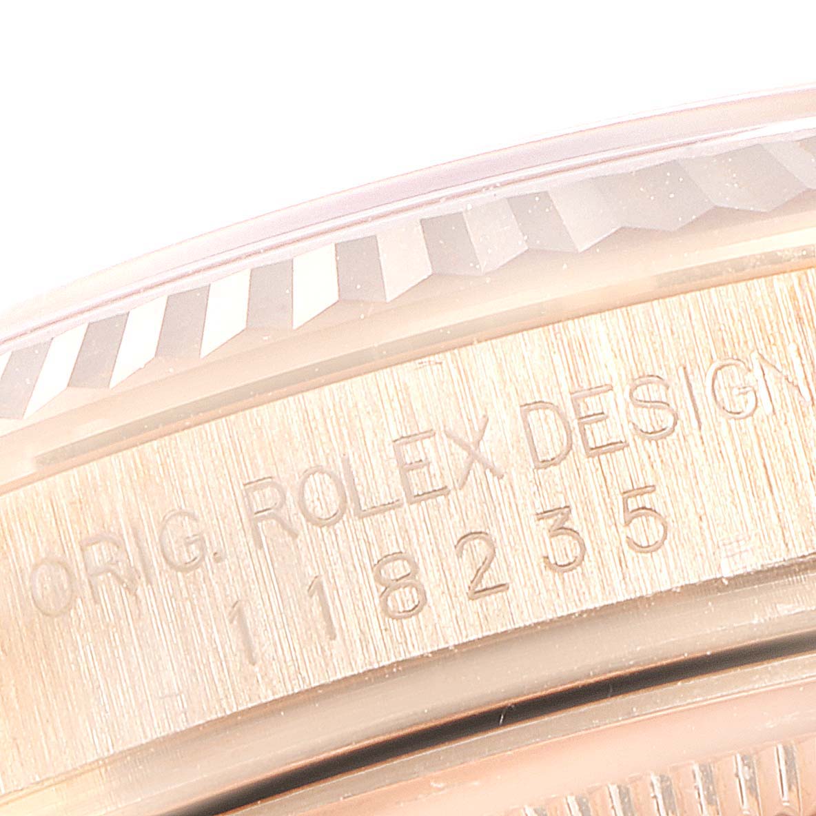 The image shows a close-up view of the case edge and bezel of a Rolex President 118235 Men's Rose Gold Pink Dial 118235 Men's Rose Gold Pink Dial model.