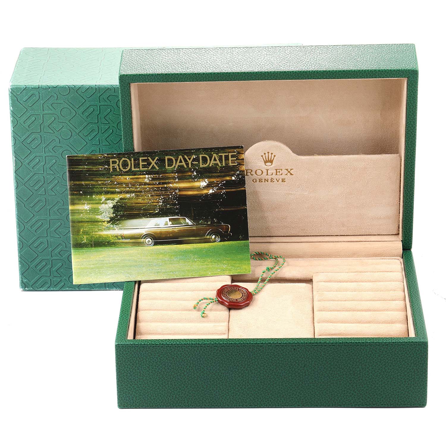 This image shows a Rolex President 18238 Men
s Yellow Gold White Dial 18238 Men
s Yellow Gold White Dial model watch box, booklet, and tag seen from an angle that reveals the interior compartments.