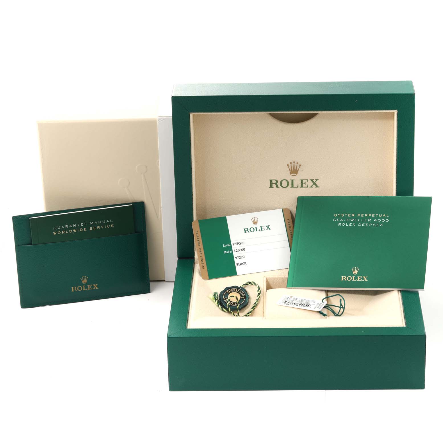 This image shows the packaging, warranty card, and manuals for the Rolex Sea-Dweller 126600 Men
s Stainless Steel Black Dial 126600 Men
s Stainless Steel Black Dial model, along with other accessories.