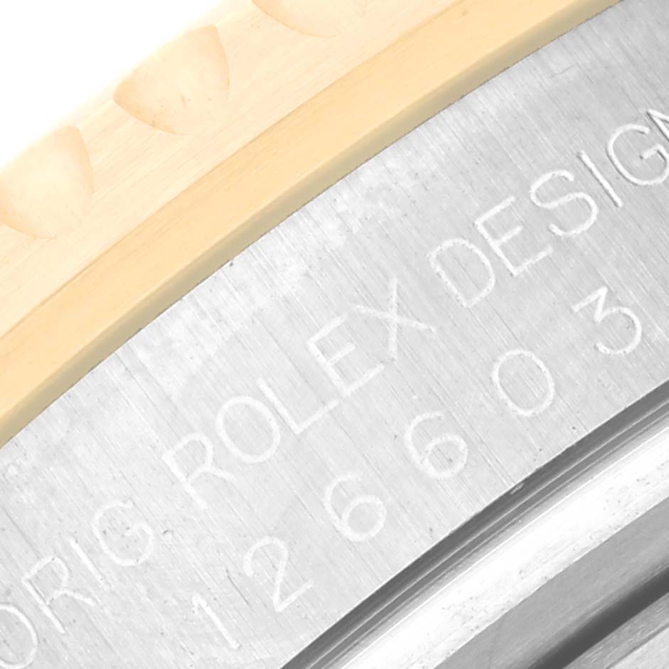 This image shows a close-up of the engraved case back of the Rolex Sea-Dweller 126603 Men
s Steel and Gold (two tone) Black Dial 126603 Men
s Steel and Gold (two tone) Black Dial watch.