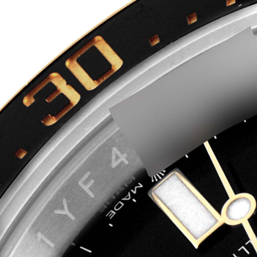 This image shows a close-up of the bezel and part of the dial of a Rolex Sea-Dweller 126603 Men
s Steel and Gold (two tone) Black Dial 126603 Men
s Steel and Gold (two tone) Black Dial watch.