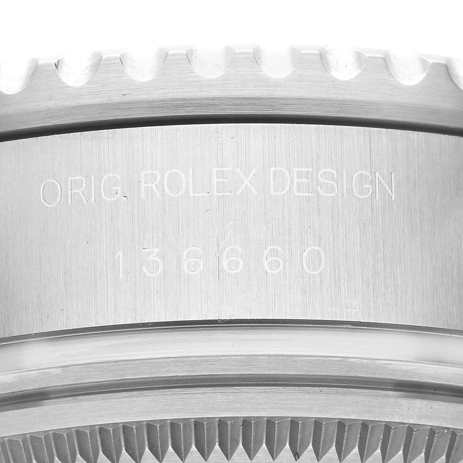 This close-up image shows the bezel and case engraving of a Rolex Sea-Dweller 136660 Men
s Stainless Steel Blue Dial 136660 Men
s Stainless Steel Blue Dial watch, revealing the model number 136660.