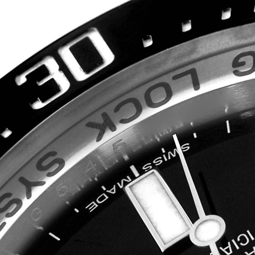 This image shows a close-up of the bezel, dial, and part of the second hand of the Rolex Sea-Dweller 116660 Men
s Stainless Steel Black Dial 116660 Men
s Stainless Steel Black Dial wristwatch.