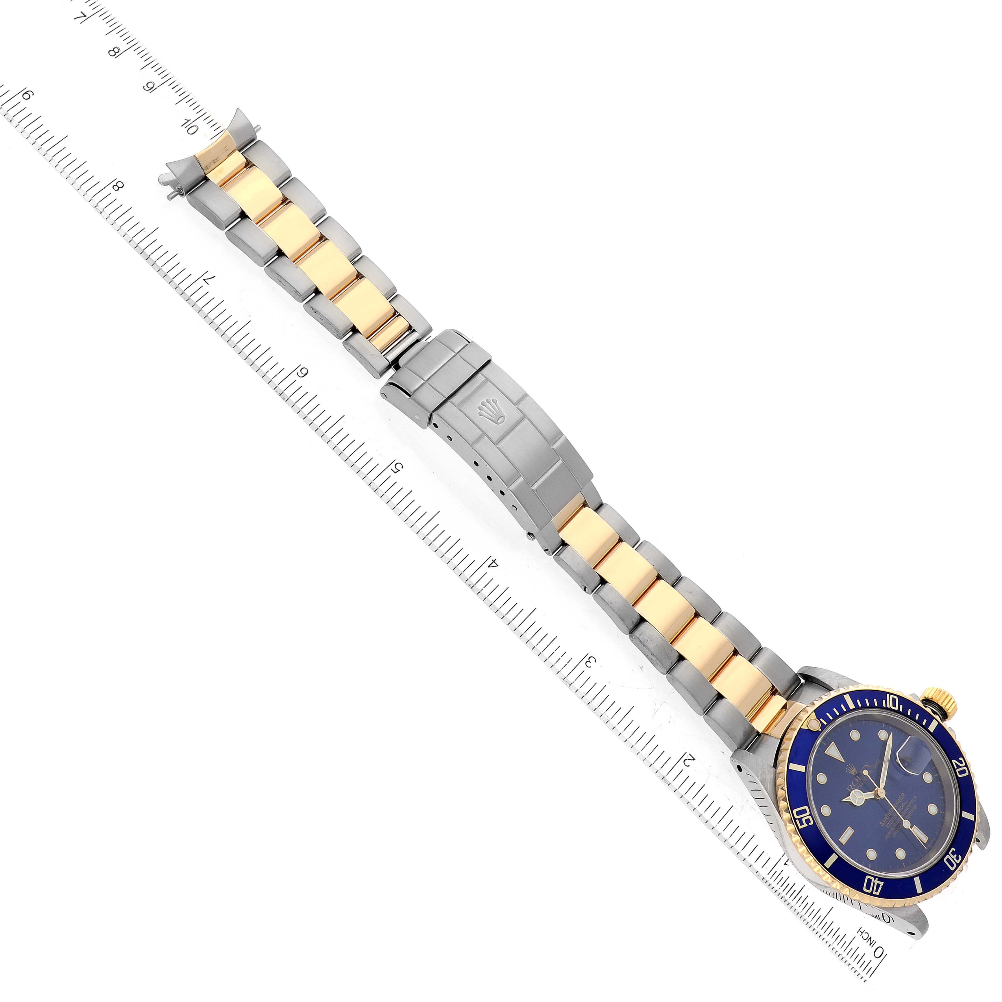 The image shows a side view of a Rolex Submariner 16613 Men's Steel and Gold (two tone) Blue Dial 16613 Men's Steel and Gold (two tone) Blue Dial watch, displaying the band and clasp.