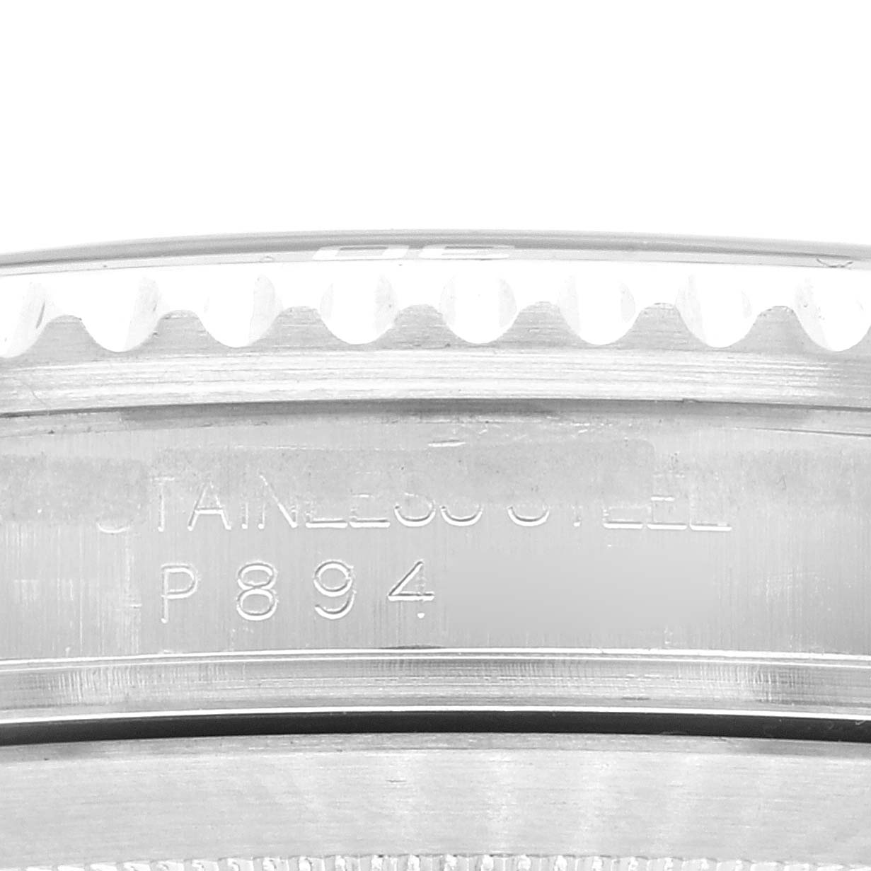 This image shows a close-up of the serial number area on the side of a Rolex Submariner 16610 Men
s Stainless Steel Black Dial 16610 Men
s Stainless Steel Black Dial watch.