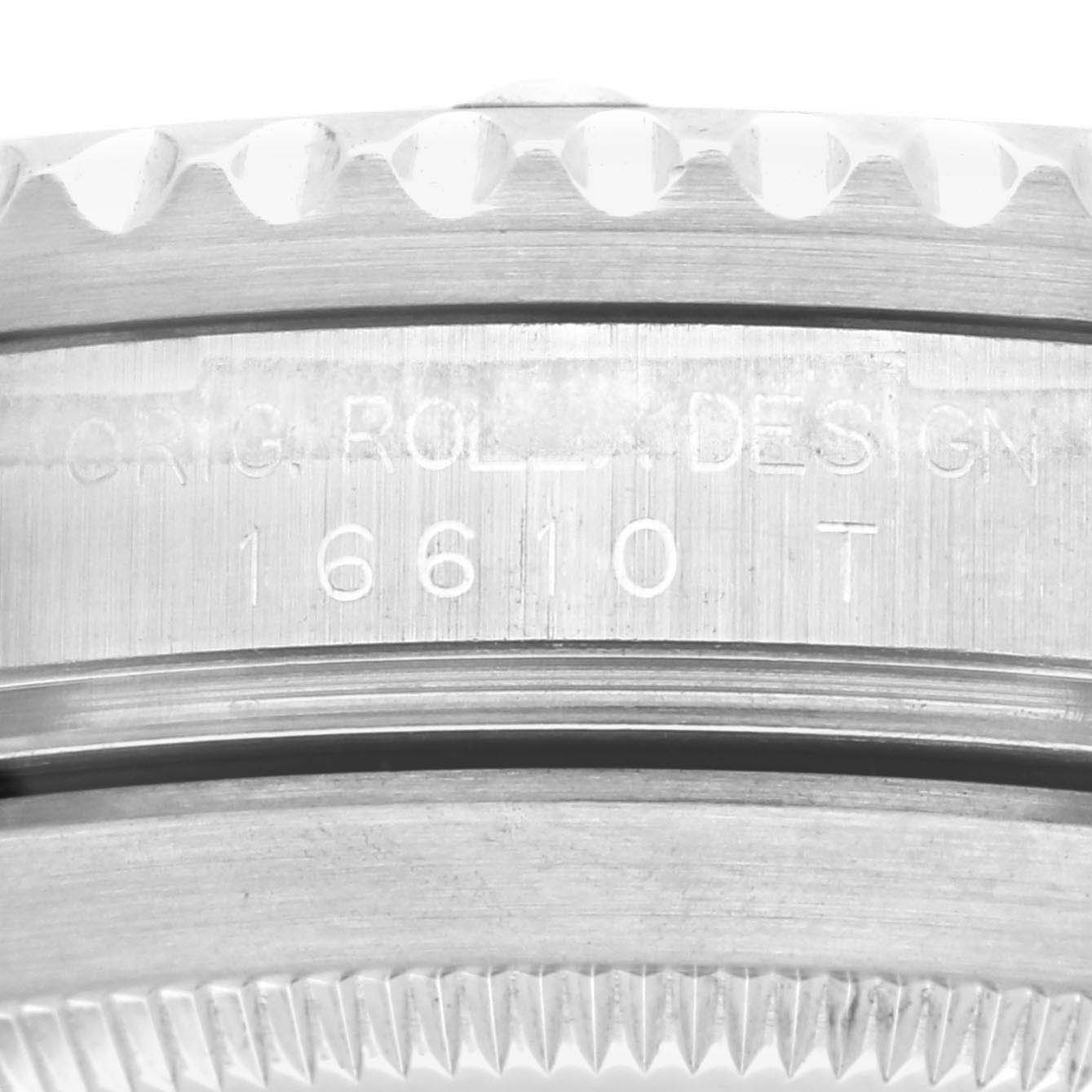 This image shows a close-up of the side of a Rolex Submariner 16610 Men
s Stainless Steel Black Dial 16610 Men
s Stainless Steel Black Dial watch, highlighting the engraved model number "16610 T."