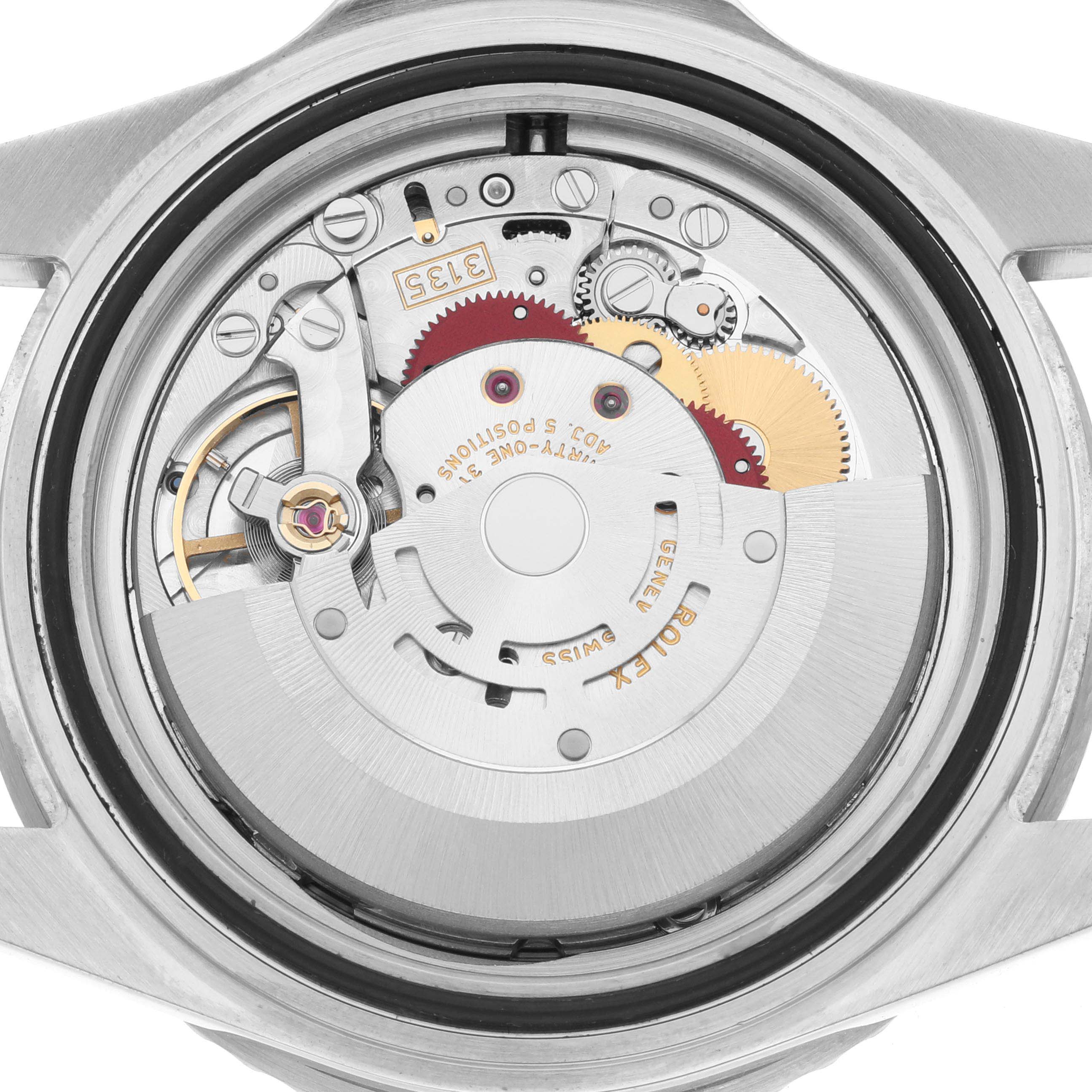 The image shows an inside view of the Rolex Submariner 16610 Men
s Stainless Steel Black Dial 16610 Men
s Stainless Steel Black Dial watch, specifically displaying its movement mechanisms.