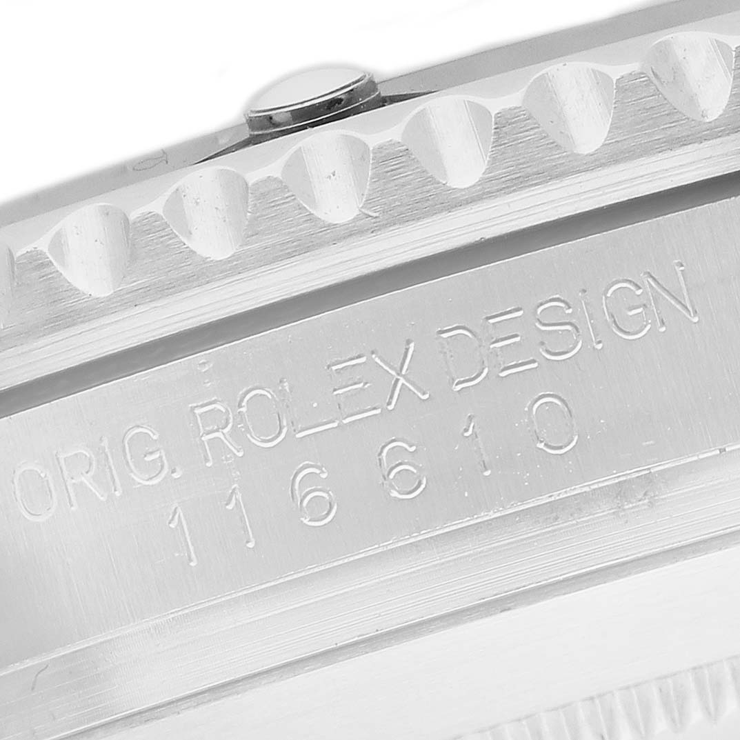 The image shows a close-up of the underside inscription on the bezel of the Rolex Sky-Dweller 116610 Men's Stainless Steel Black Dial, focusing on the design and model number.