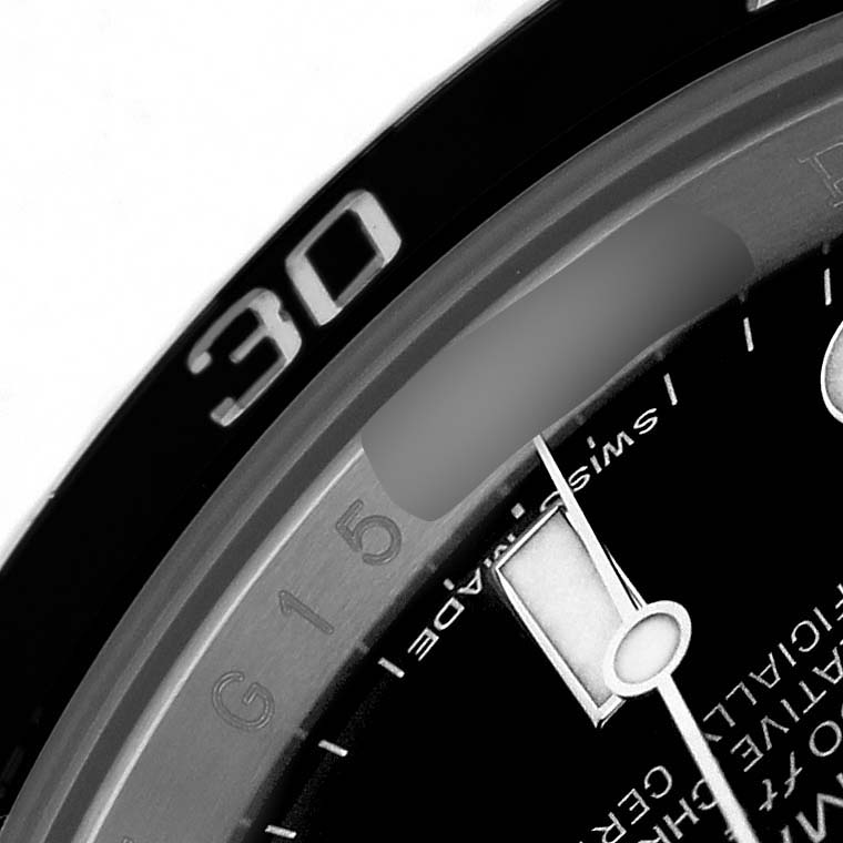 The image shows a close-up of the bezel and part of the dial of a Rolex Sky-Dweller 116610 Men's Stainless Steel Black Dial, focusing on the 30-minute marker and hour hand.