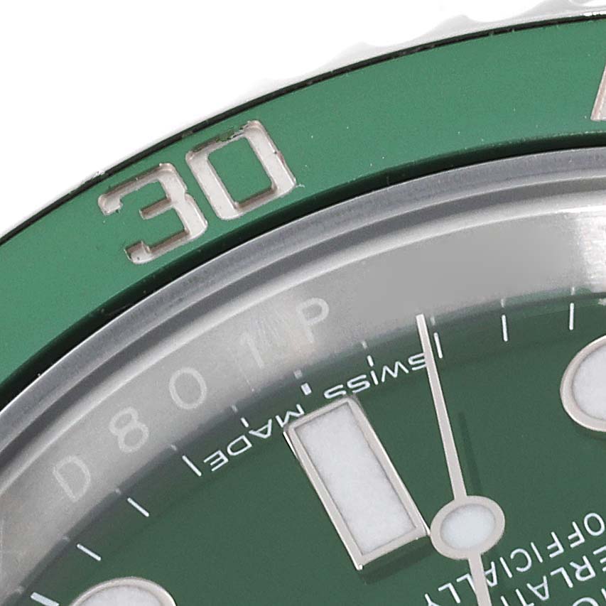 This image shows a close-up of the green bezel and part of the dial of a Rolex Submariner 116610LV Men
s Stainless Steel Green Dial 116610LV Men
s Stainless Steel Green Dial watch.
