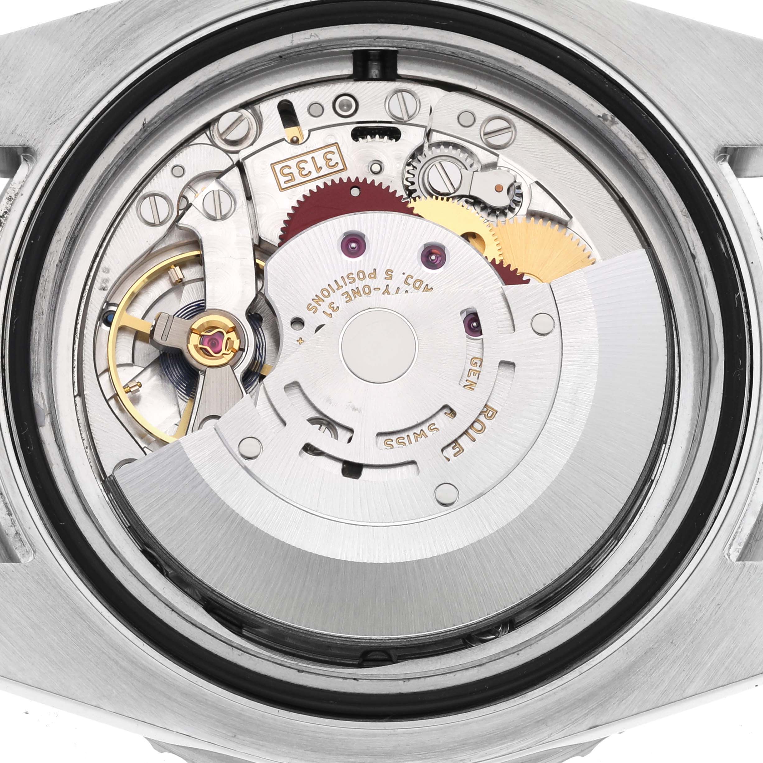 This is a close-up view of the movement inside a Rolex Submariner 116610LV Men
s Stainless Steel Green Dial 116610LV Men
s Stainless Steel Green Dial watch case, showing gears and mechanical parts.