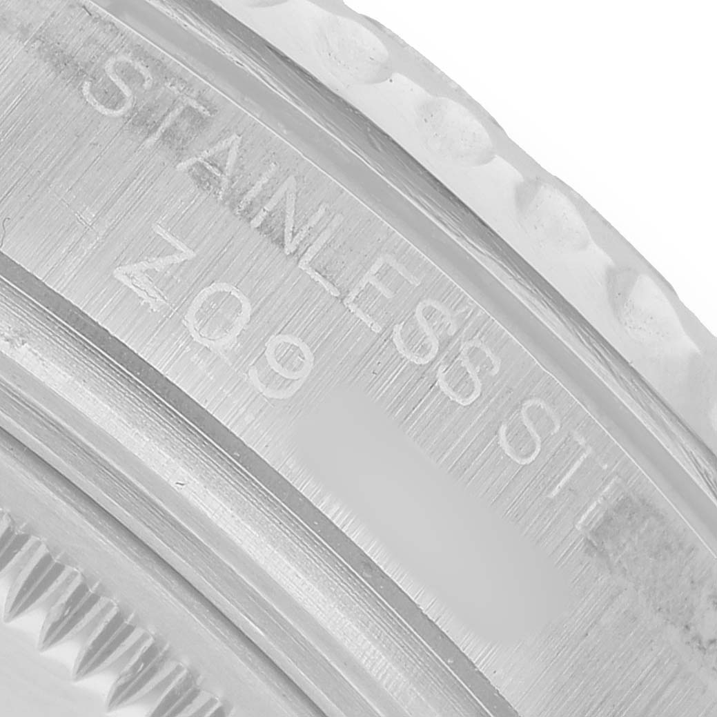 The image shows a close-up of the Rolex Yacht-Master 168622 Women's Stainless Steel Silver Dial's stainless steel case, focusing on the engraved text.
