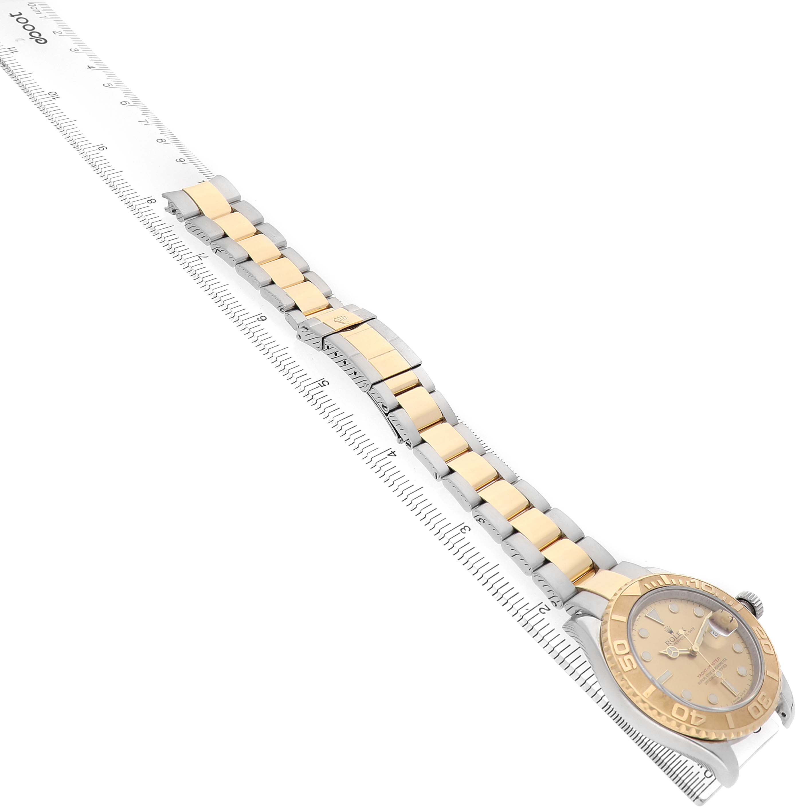 The Rolex Yacht-Master 16623 Men's Steel and Gold (two tone) Champagne Dial watch is displayed at a diagonal angle, showcasing the full bracelet and face.