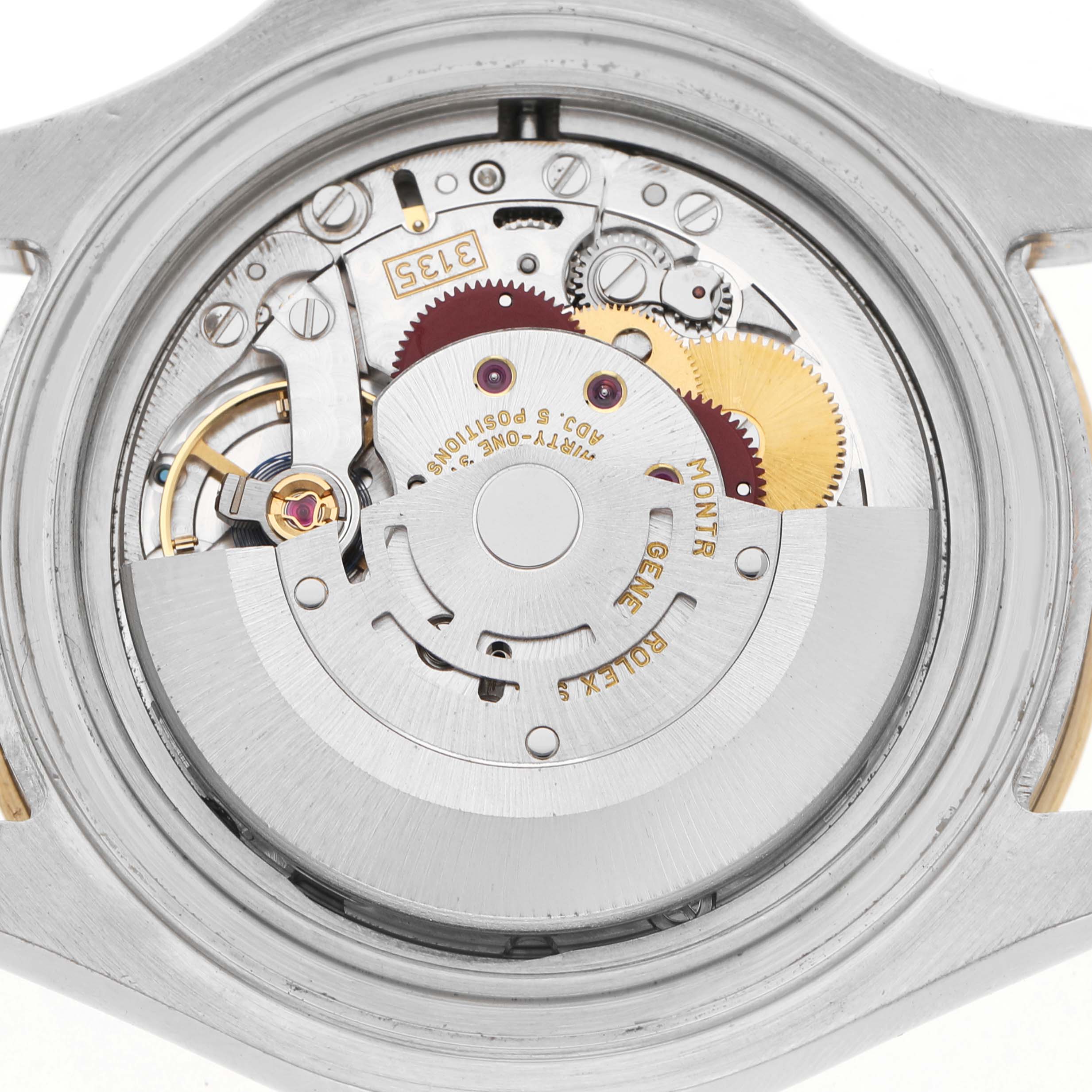 The image shows the back view of the Rolex Yacht-Master 16623 Men's Steel and Gold (two tone) Champagne Dial watch, highlighting its intricate movement and internal mechanism.