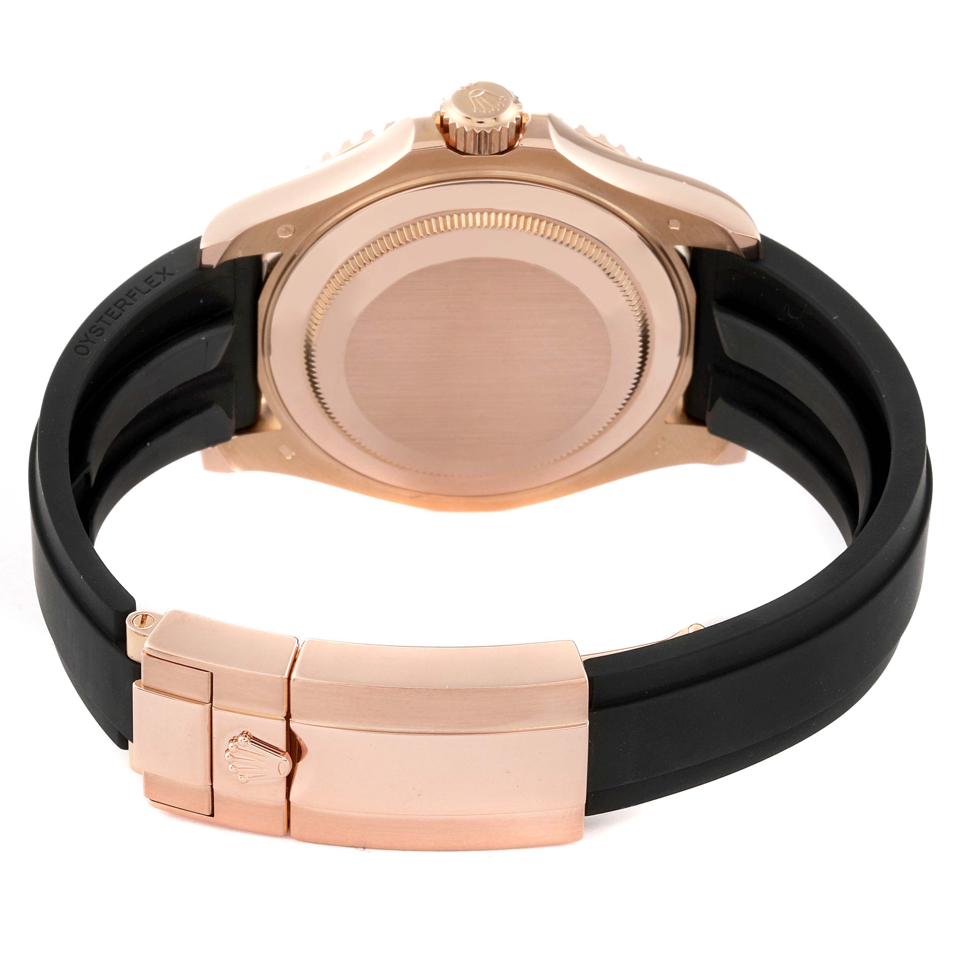 The image shows the back case and clasp of a Rolex Yacht-Master 116655 Men's Rose Gold Black Dial 116655 Men's Rose Gold Black Dial watch with a black rubber strap and rose gold hardware.