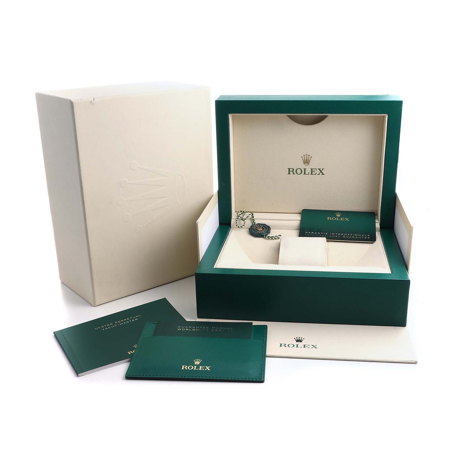 The image shows the Rolex Yacht-Master 226659 Men's White Gold Black Dial's packaging, box, manual, and warranty card from a perspective angle.