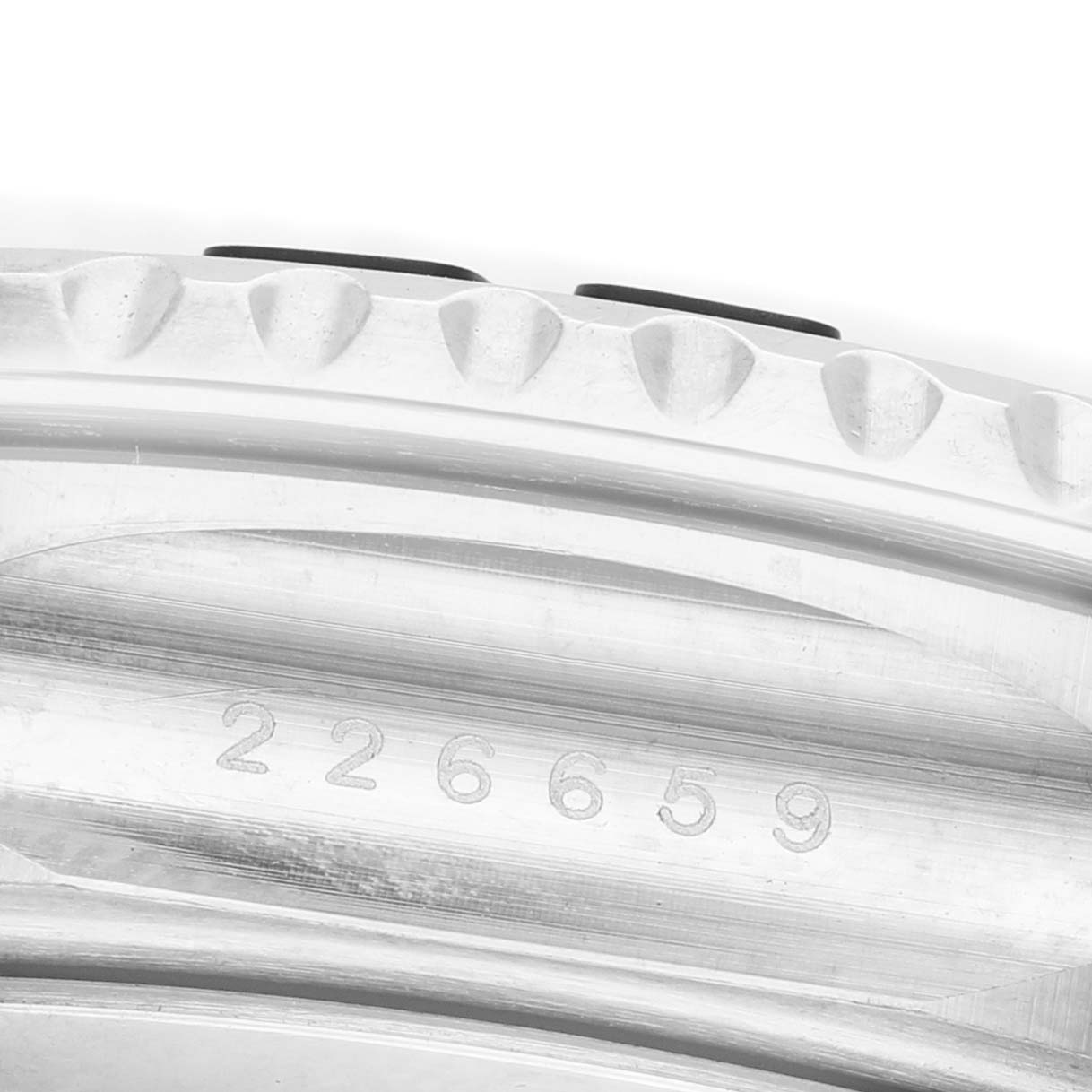 The image shows a close-up of the Rolex Yacht-Master 226659 Men's White Gold Black Dial's bezel, highlighting its texture and engraved model number.