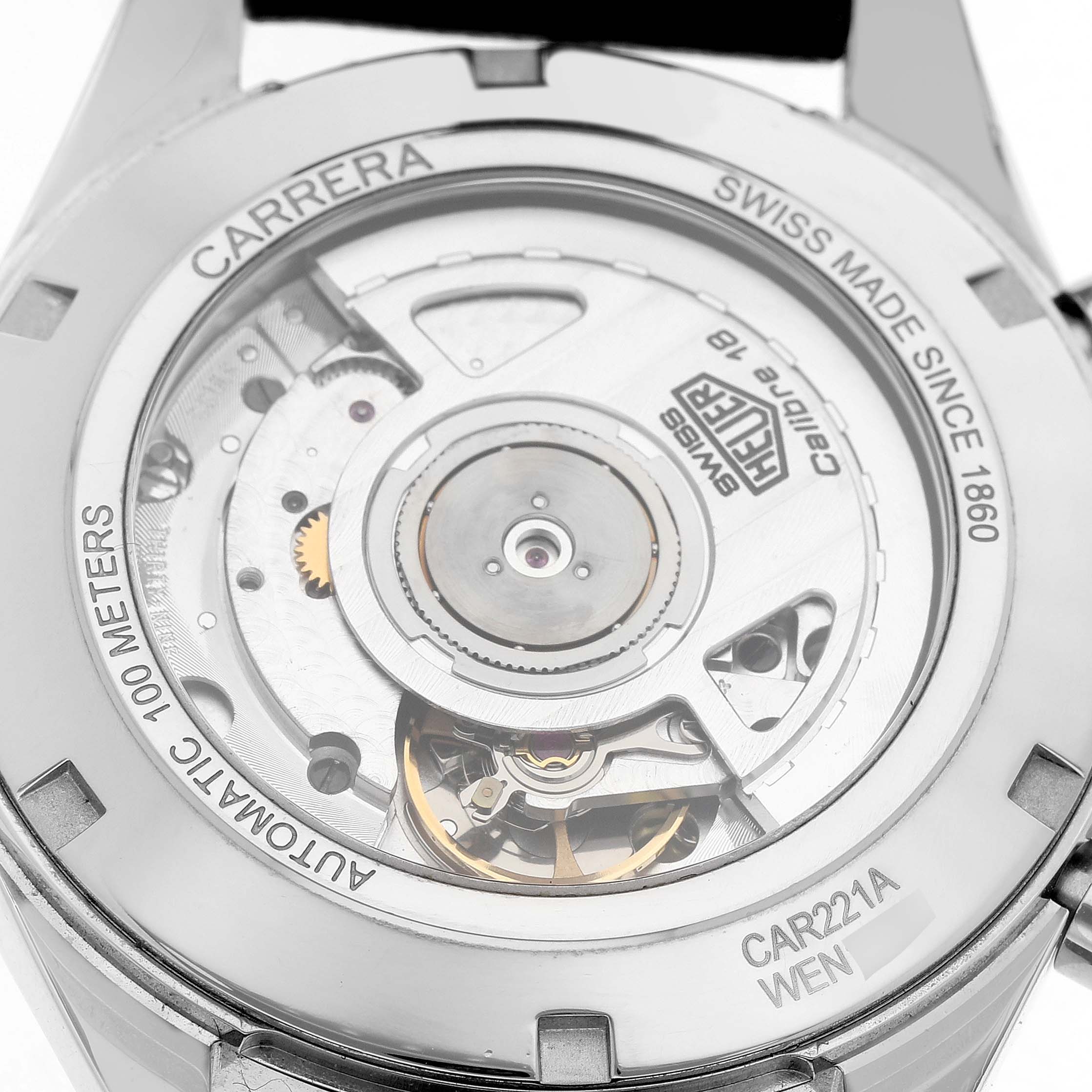 The image shows the back of the Tag Heuer Carrera CAR221A Men's Stainless Steel Silver Dial, highlighting the automatic movement and internal mechanics.