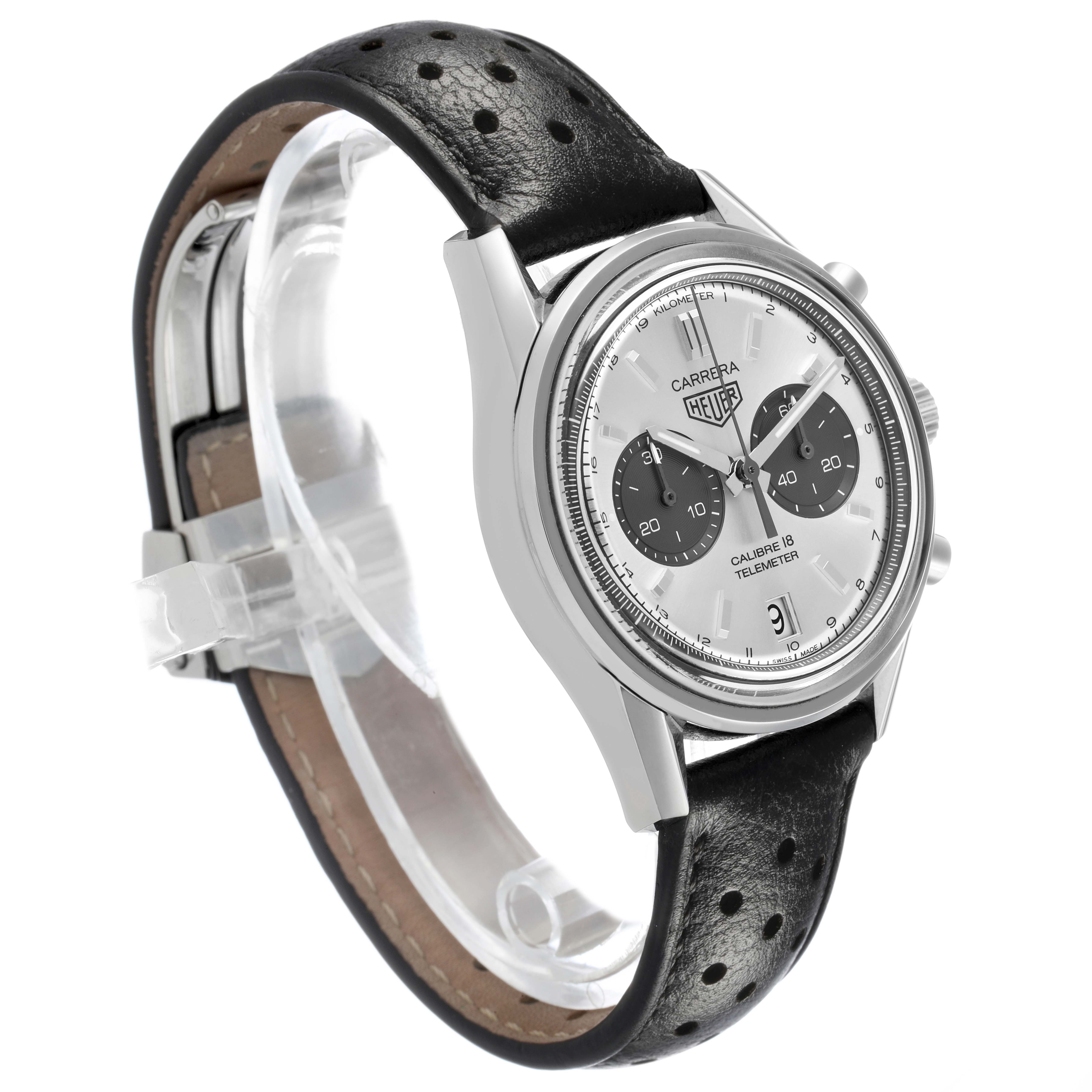 The Tag Heuer Carrera CAR221A Men's Stainless Steel Silver Dial watch is presented at a three-quarter angle, highlighting the face, case, and perforated black leather strap.