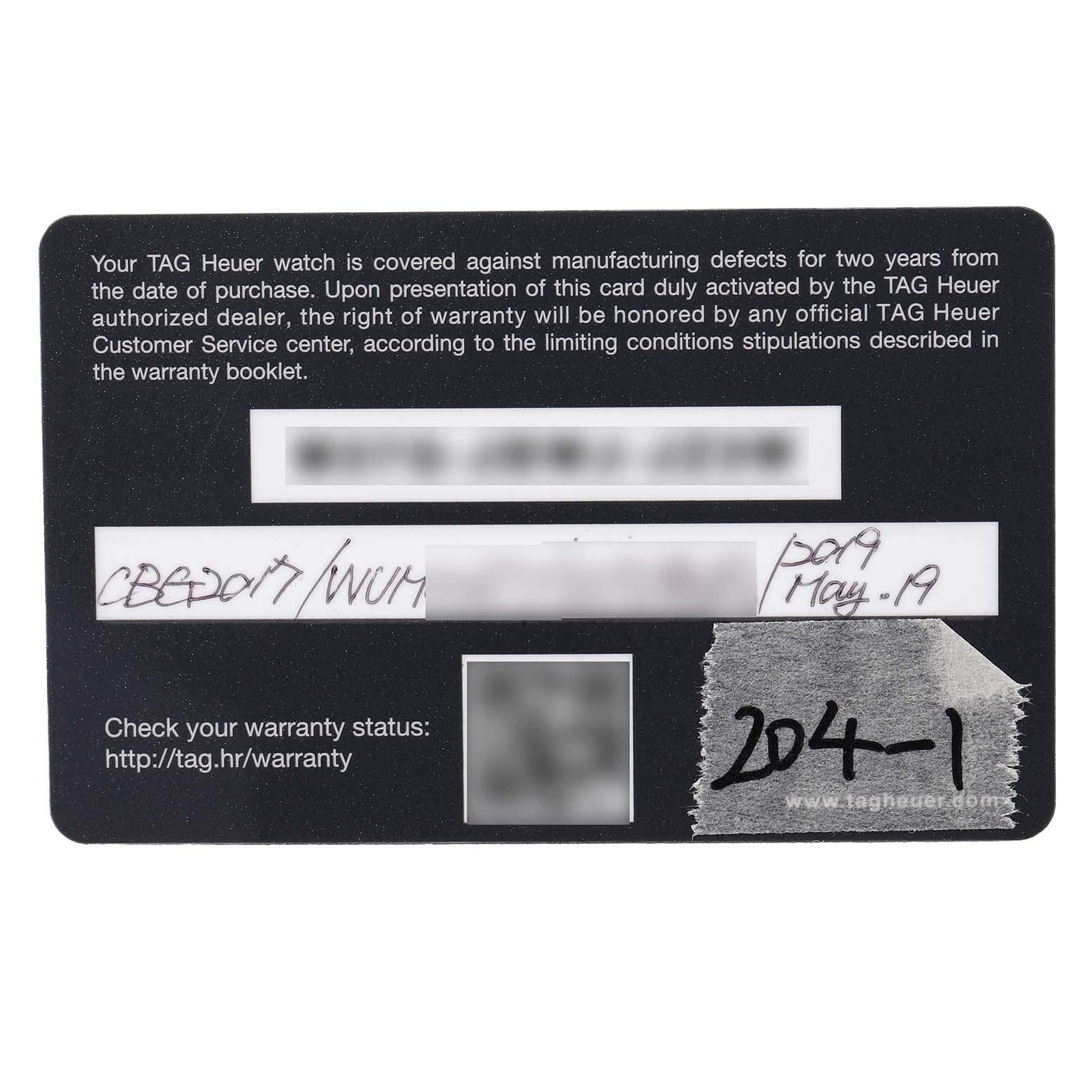 The image shows a TAG Heuer Carrera model warranty card, providing warranty details.