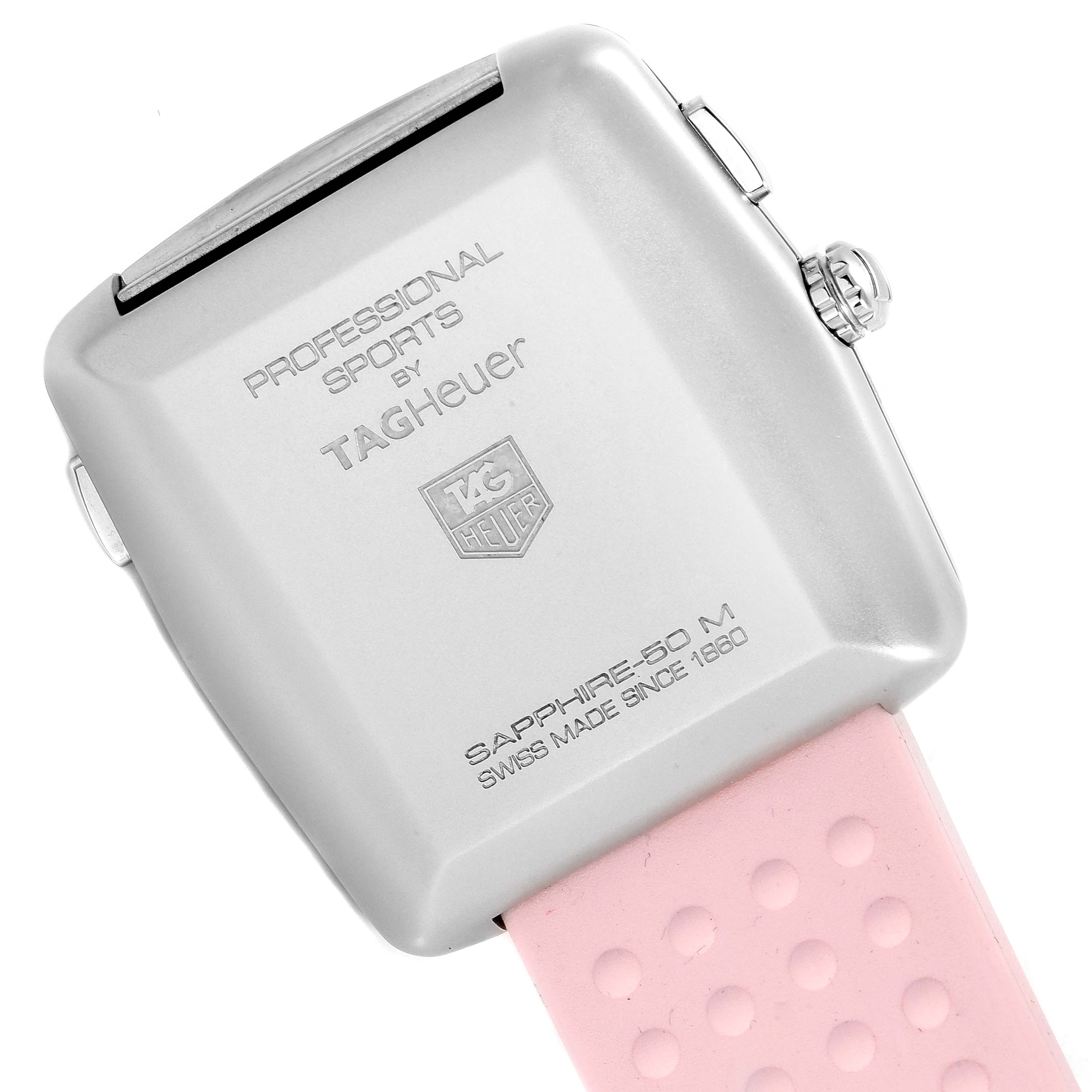 The image shows the back of a Tag Heuer Monaco WAE1114.FT6011 Women's Stainless Steel Mother of Pearl Dial WAE1114.FT6011 Women's Stainless Steel Mother of Pearl Dial model watch with a pink strap, viewed at an angle.