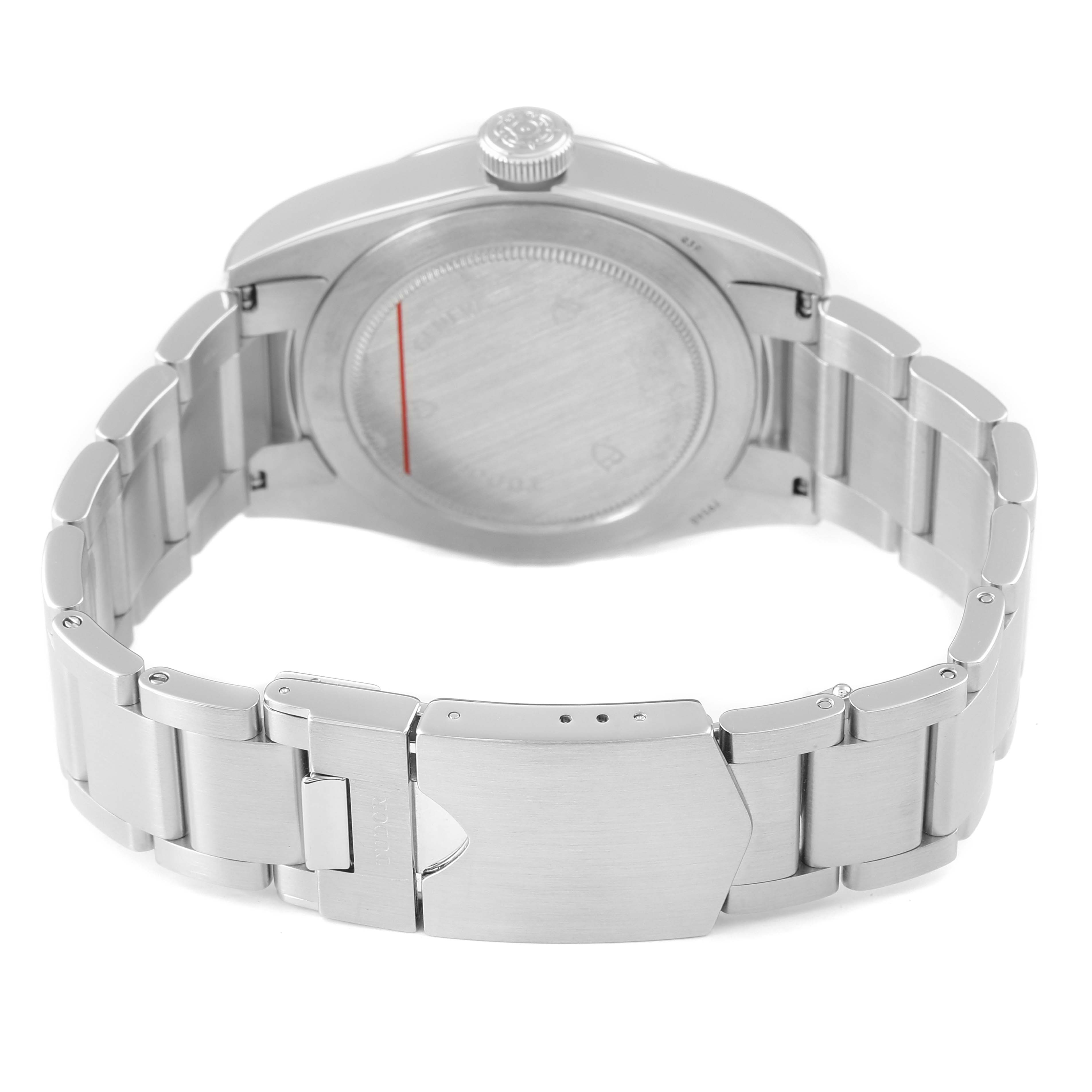 The image shows the backside and stainless steel bracelet of a Tudor Heritage Black Bay M79540 Men's Stainless Steel Silver Dial watch, highlighting its clasp and case back.