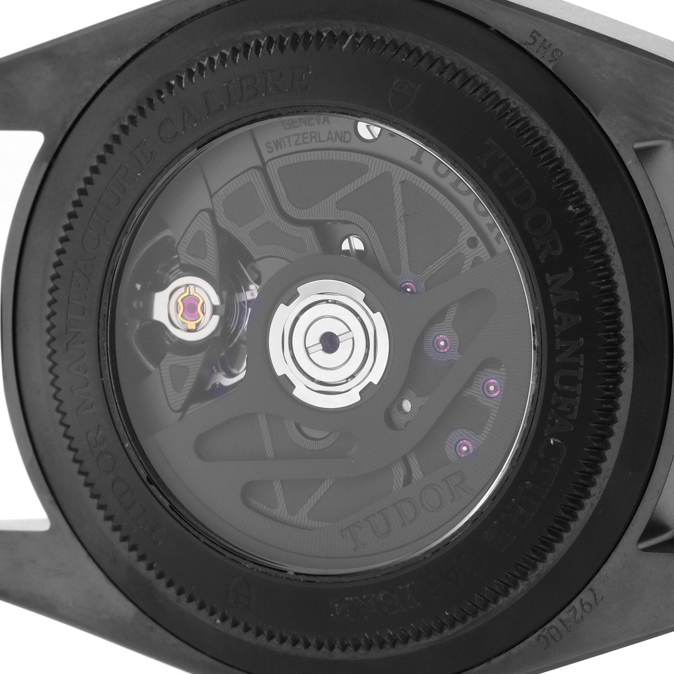 The image shows the back view of the Tudor Heritage Black Bay 79210 Men's Ceramic Black Dial 79210 Men's Ceramic Black Dial watch, highlighting its movement and rotor.