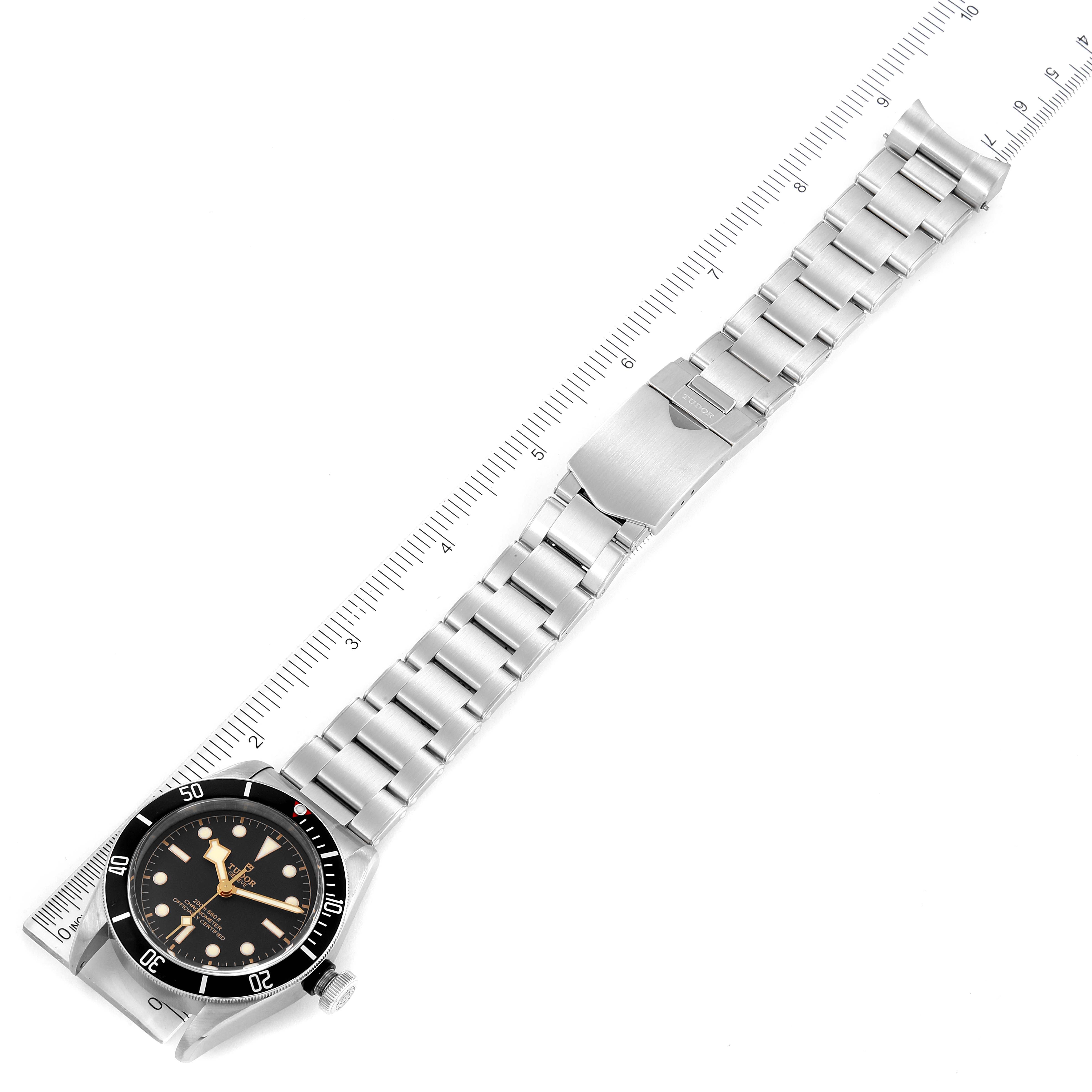 The Tudor Heritage Black Bay 79230 Men's Stainless Steel Black Dial 79230 Men's Stainless Steel Black Dial watch is shown from an angled top view, displaying the full stainless steel bracelet and clasp.