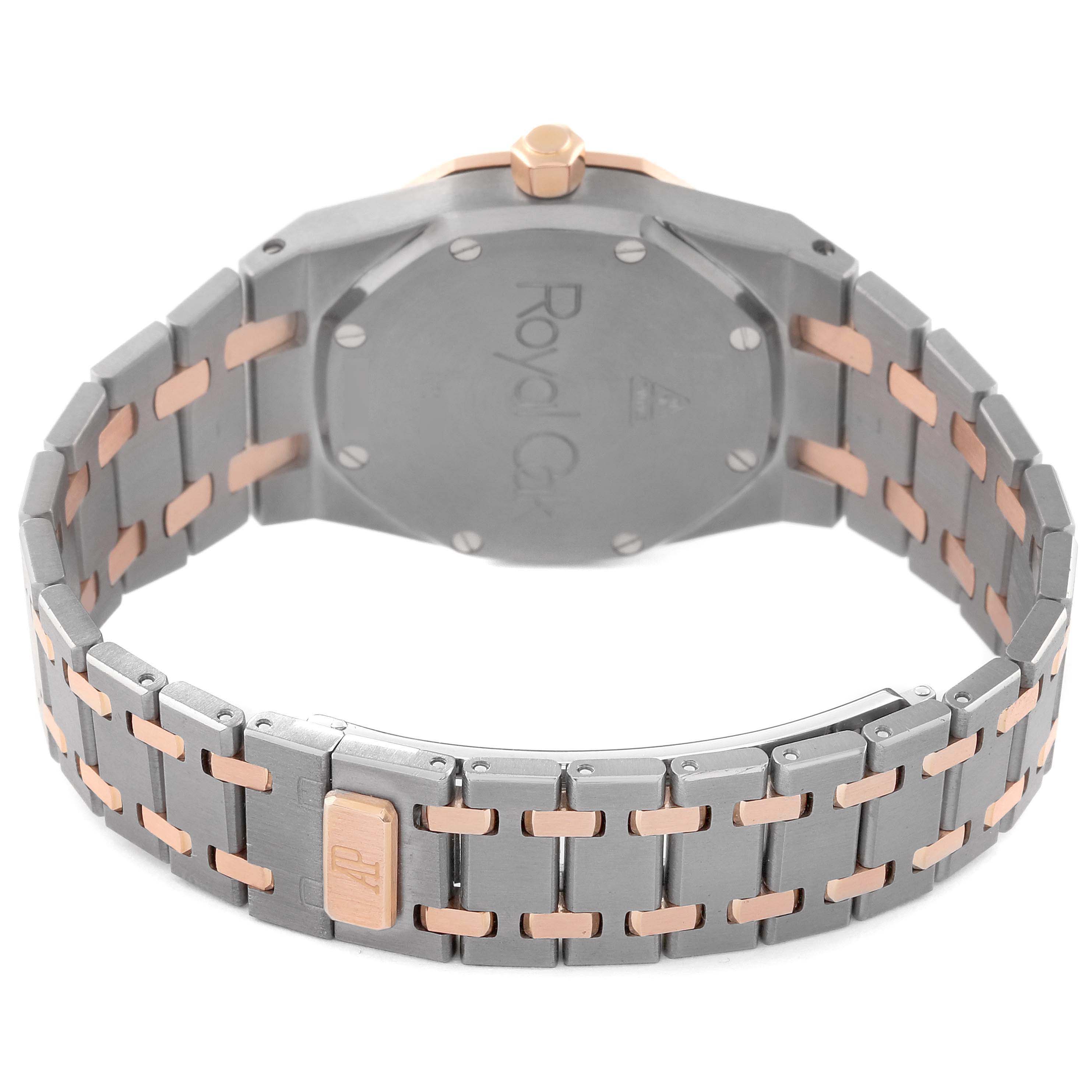 The image shows the back and bracelet of an Audemars Piguet Royal Oak 15000TR Men's Titanium Pink Dial watch, highlighting the dual-tone links and clasp.