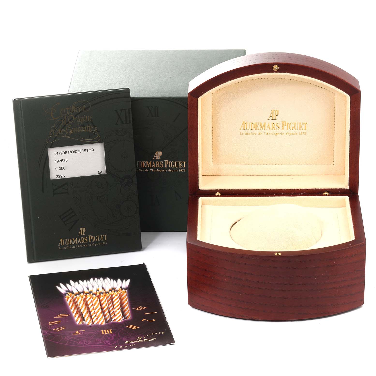The image shows a Royal Oak watch box by Audemars Piguet, its certificate, and a booklet, viewed from the front.