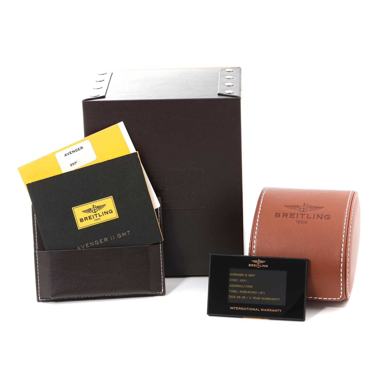 The image shows the packaging and accessories for a Breitling Avenger A3239011/C930 Men's Stainless Steel Mother of Pearl Dial A3239011/C930 Men's Stainless Steel Mother of Pearl Dial II GMT, including the box, manual, leather pouch, and warranty card.