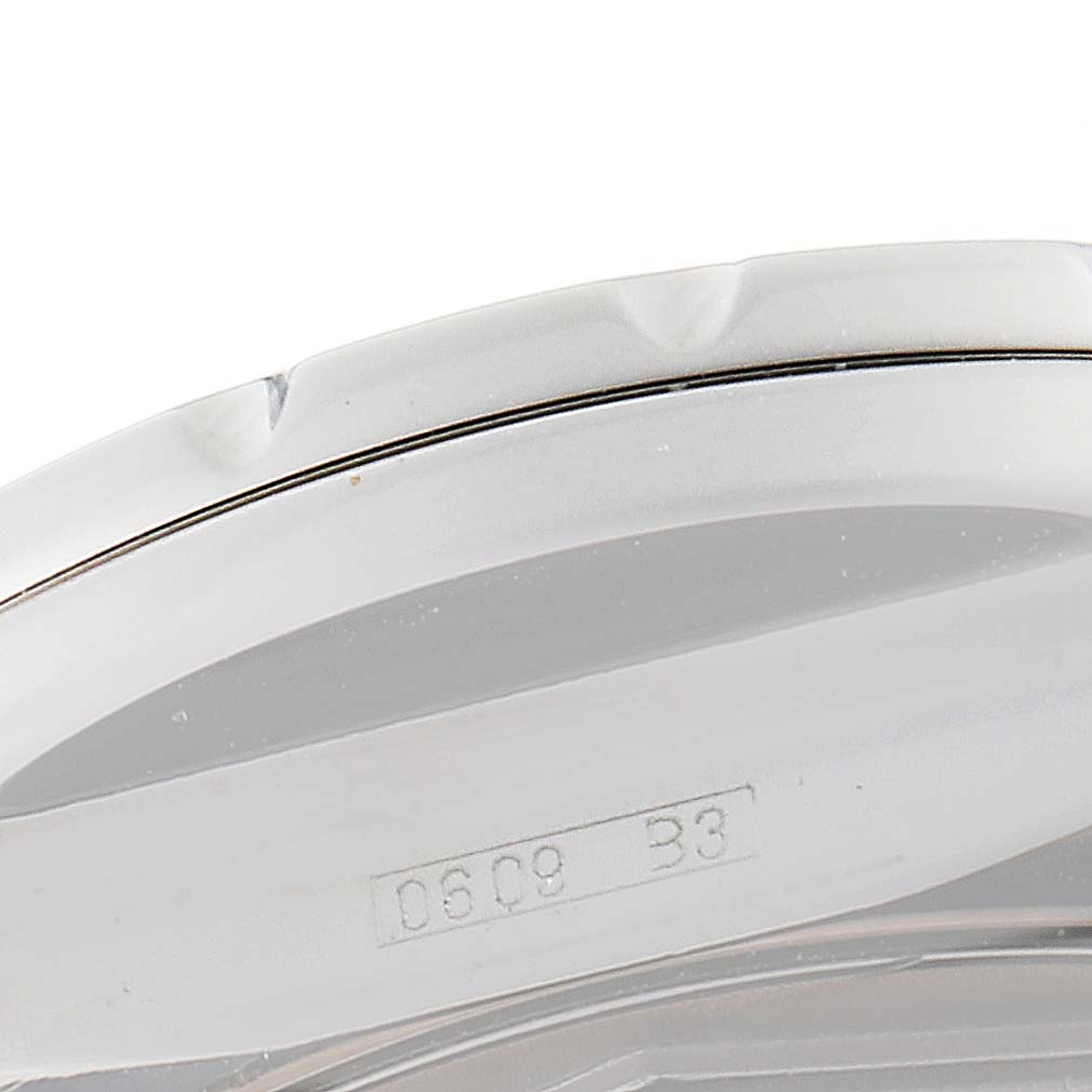 This image shows a close-up of the side and engraved serial number of a Bentley model by Breitling.