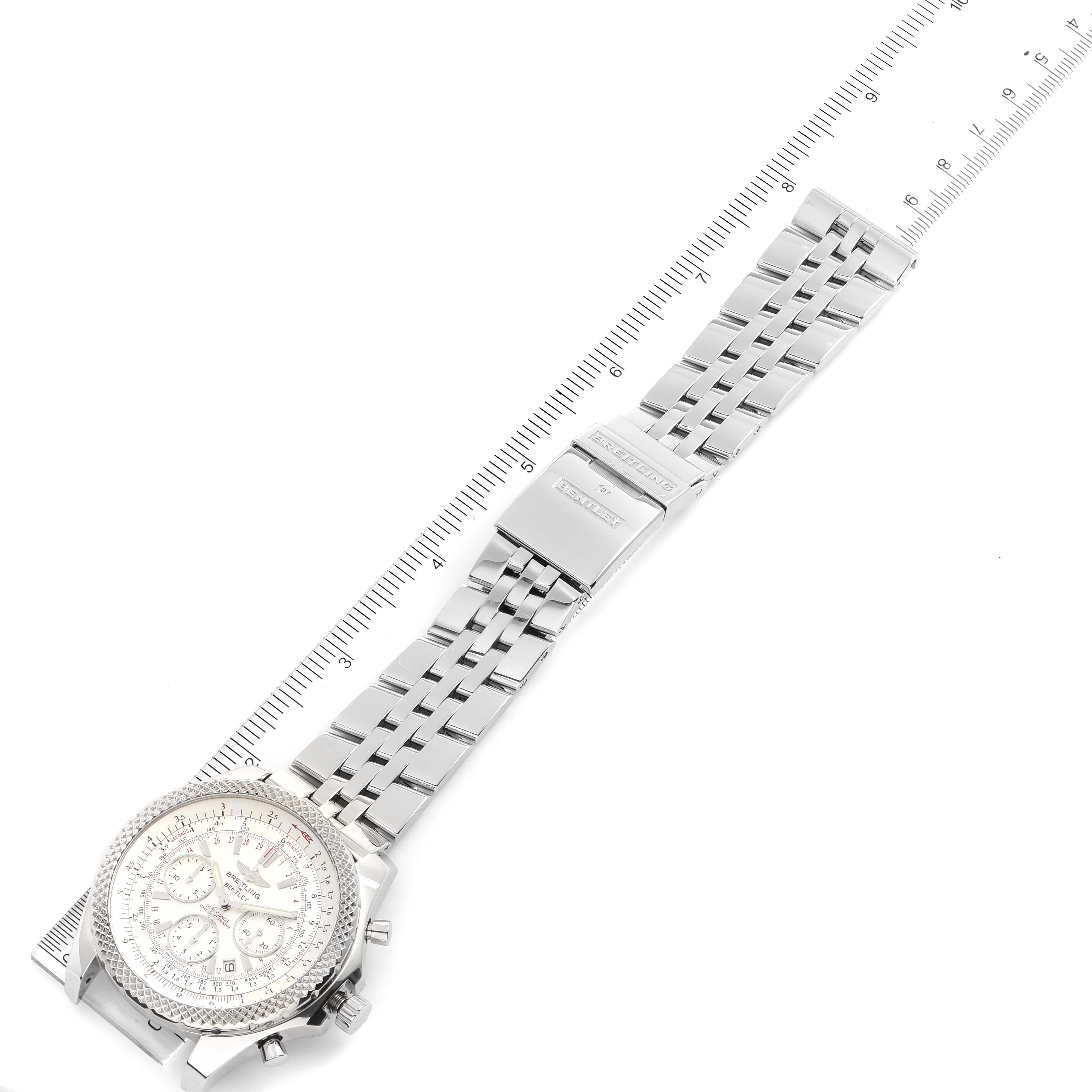 The image shows the Breitling Bentley A25364 Men's Stainless Steel Silver Dial A25364 Men's Stainless Steel Silver Dial watch positioned horizontally with its dial, bracelet, and clasp visible, measured against a ruler.