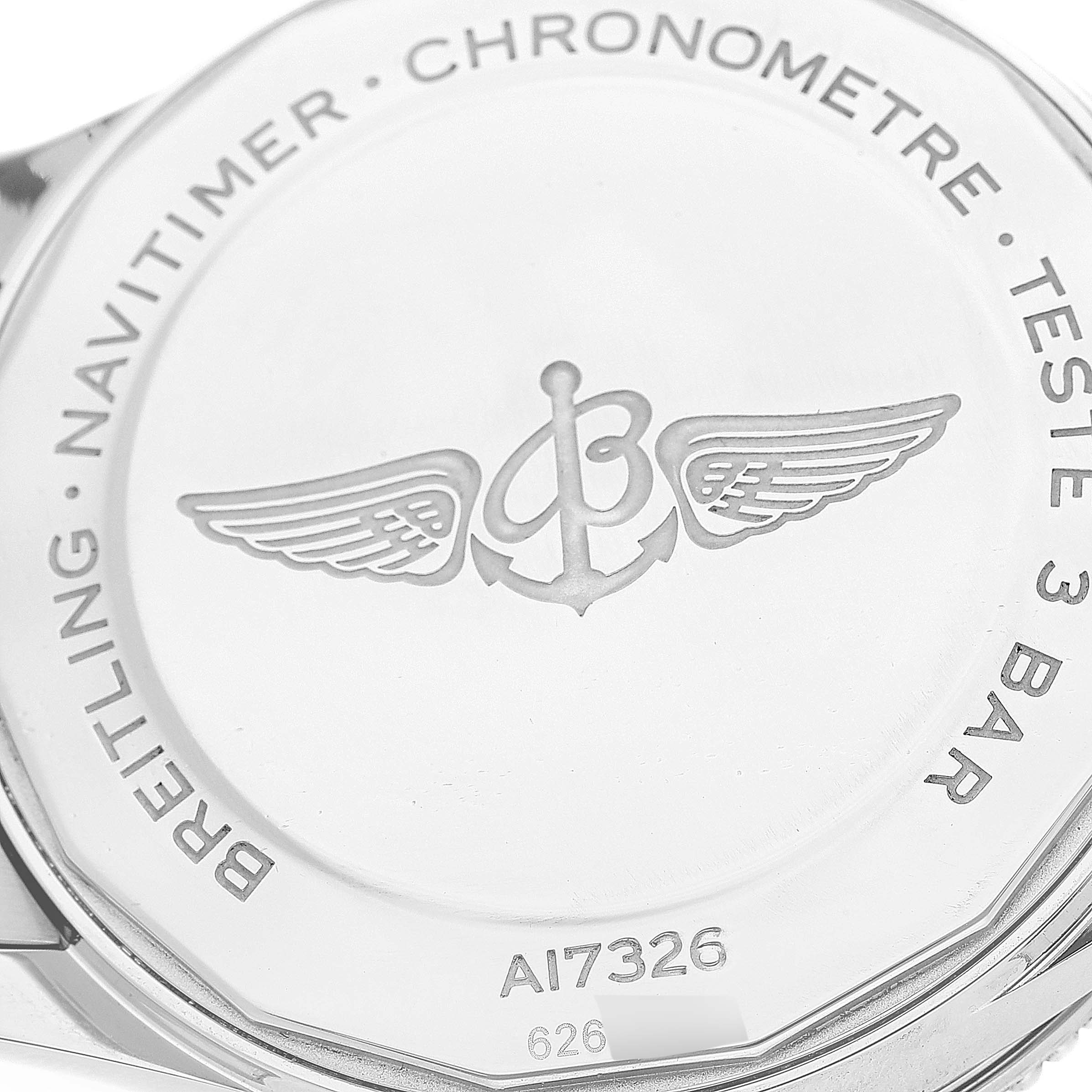 The image shows the back case of a Breitling Navitimer A17326 Men's Stainless Steel Silver Dial A17326 Men's Stainless Steel Silver Dial watch, highlighting its logo and engravings.