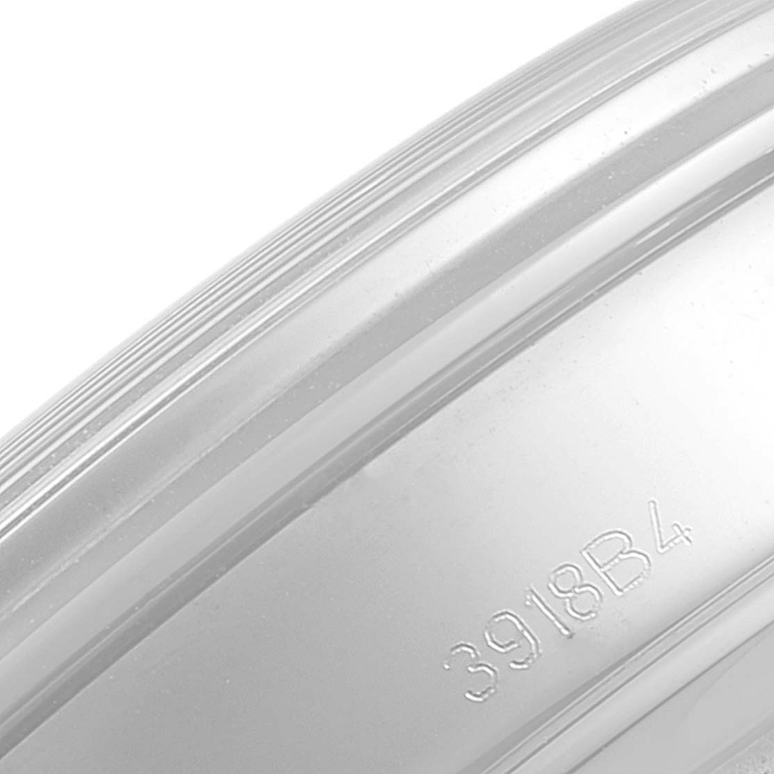 The image shows an angled close-up of the side of a Breitling Premier AB0118 Men's Stainless Steel Blue Dial AB0118 Men's Stainless Steel Blue Dial model watch case with part of its serial number visible.