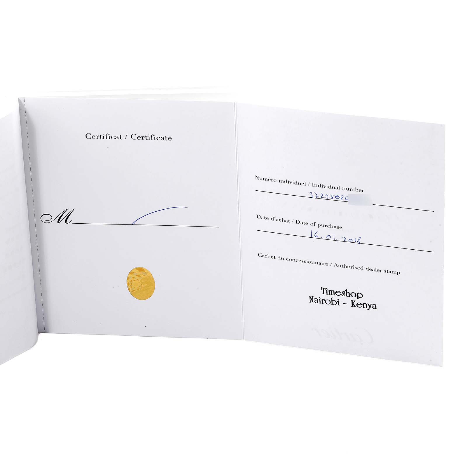 This image shows the open warranty card and certificate for the Calibre de Cartier model by Cartier.